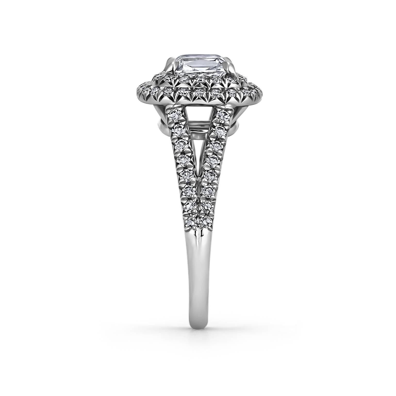 Surrounded by a double diamond halo, this 1.35 carat cushion cut center diamond is simply heavenly.  Mounted in platinum and designed by Steven Fox, it sparkles with eternal love and promise.   Center diamond color I/VVS2.  GIA certification