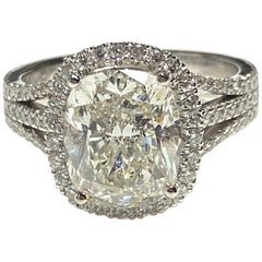Cushion Cut 4.09 Carat Diamond in Triple-Row Split Shank and Halo Setting