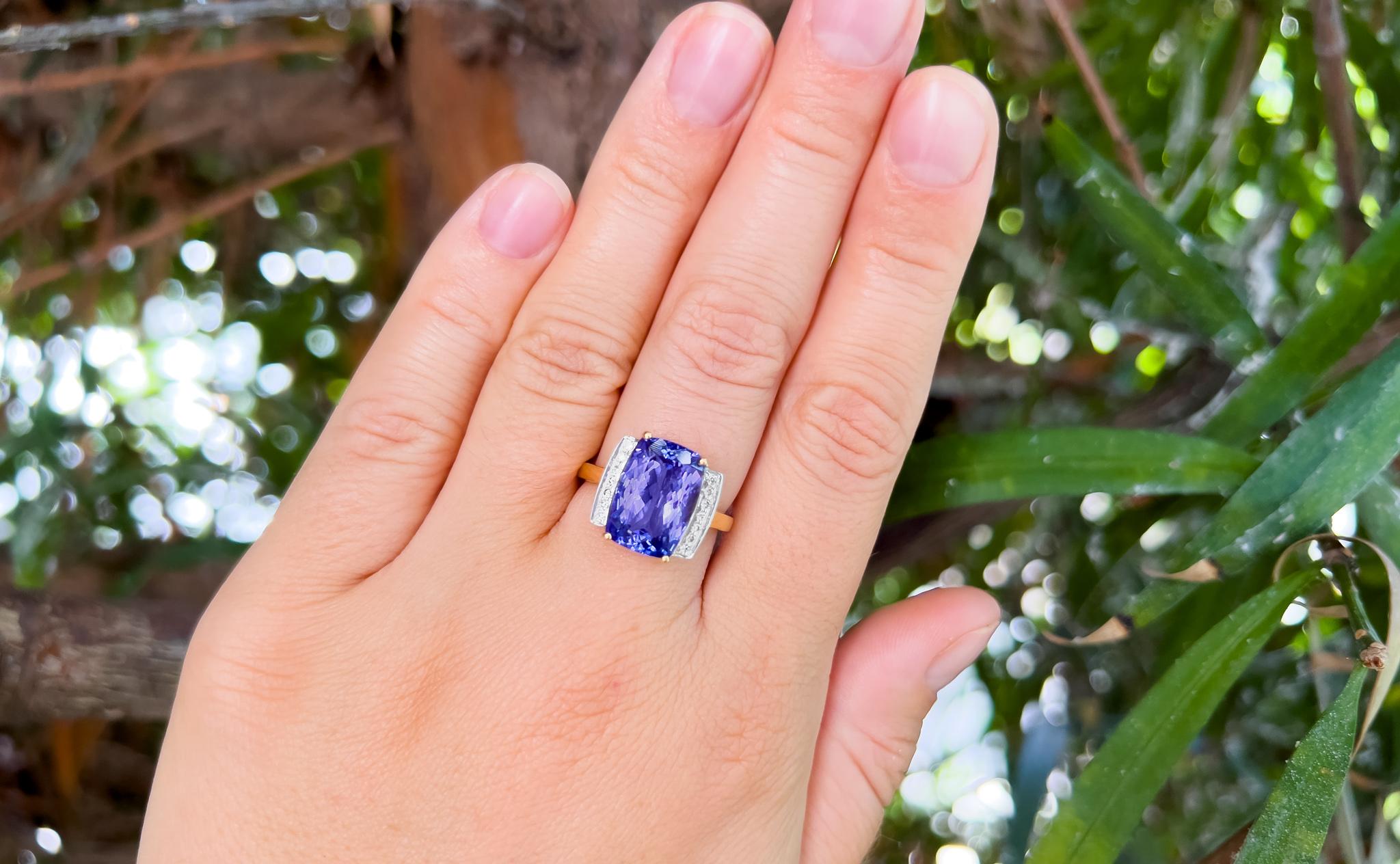 Tanzanite = 6.20 Carat
Stone Size: 13 x 9.5 x 5.8 mm
Cut: Cushion
14 Diamonds = 0.12 Carats
( Clarity: VS; Color: H )
Metal: 18K Yellow & White Gold
Ring Size: 7* US
*It can be resized complimentary