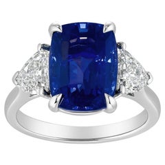 Cushion-Cut 6.36 Carat Blue Sapphire 
Diamond Three-Stone Ring