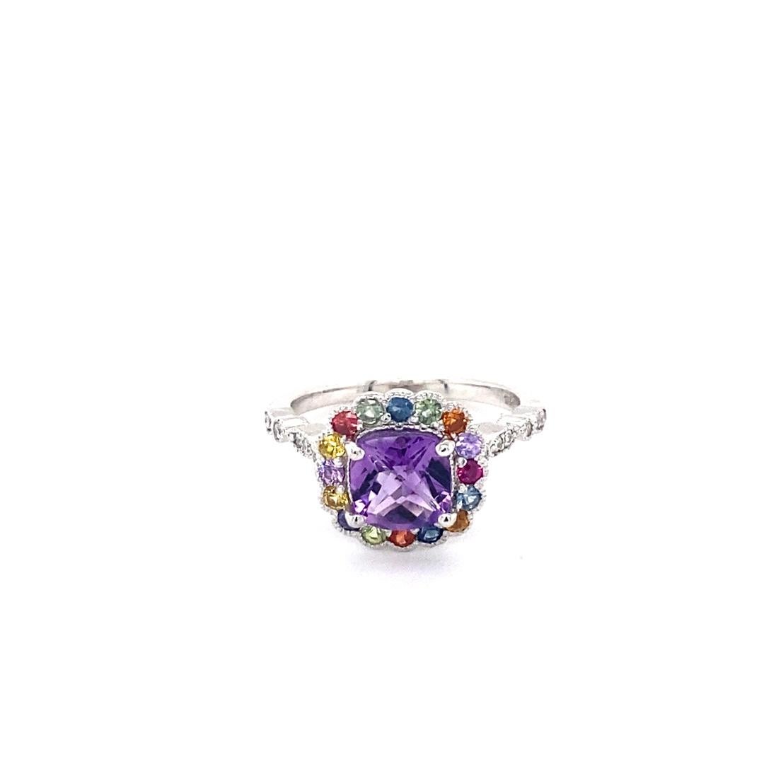 1.92 Carat Cushion Cut Amethyst Diamond Sapphire White Gold Ring

This cute and dainty ring is great for everyday wear!!  It has a 1.26 carat Cushion Cut Amethyst and is surrounded by 16 Round Cut Multicolored Sapphires that weigh 0.54 carats   and