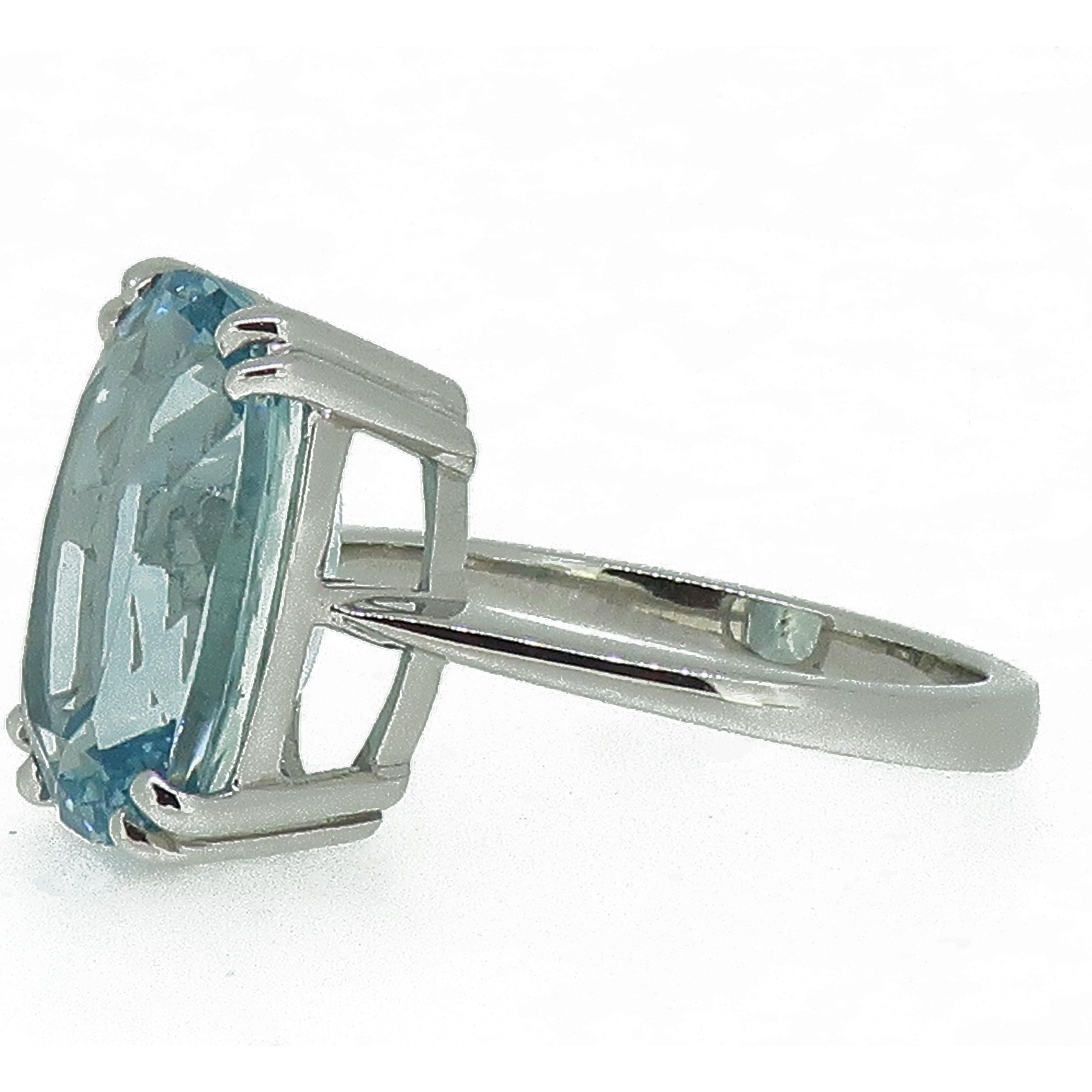 Cushion Cut Aquamarine Solitaire Ring 18 Karat White Gold

Large cushion cut aquamarine weighing just under 6ct! This incredible stone measures 14x10mm and is set in a double four claw setting. 
Simple and elegant 18ct white gold ring