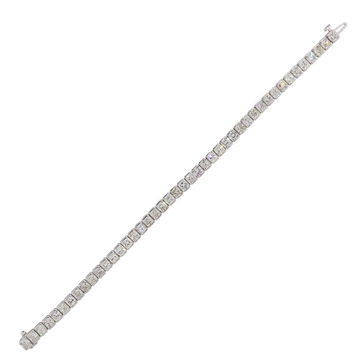 Material: 18k white gold
Diamond Details: Approximately 13.69ctw of cushion cut diamonds. Diamonds are G/H in color and VS in clarity.
Measurements: 7″ x 0.18″ x 0.13″
Clasp: Tongue in box clasp with safety clasp
Total Weight: 16.5g