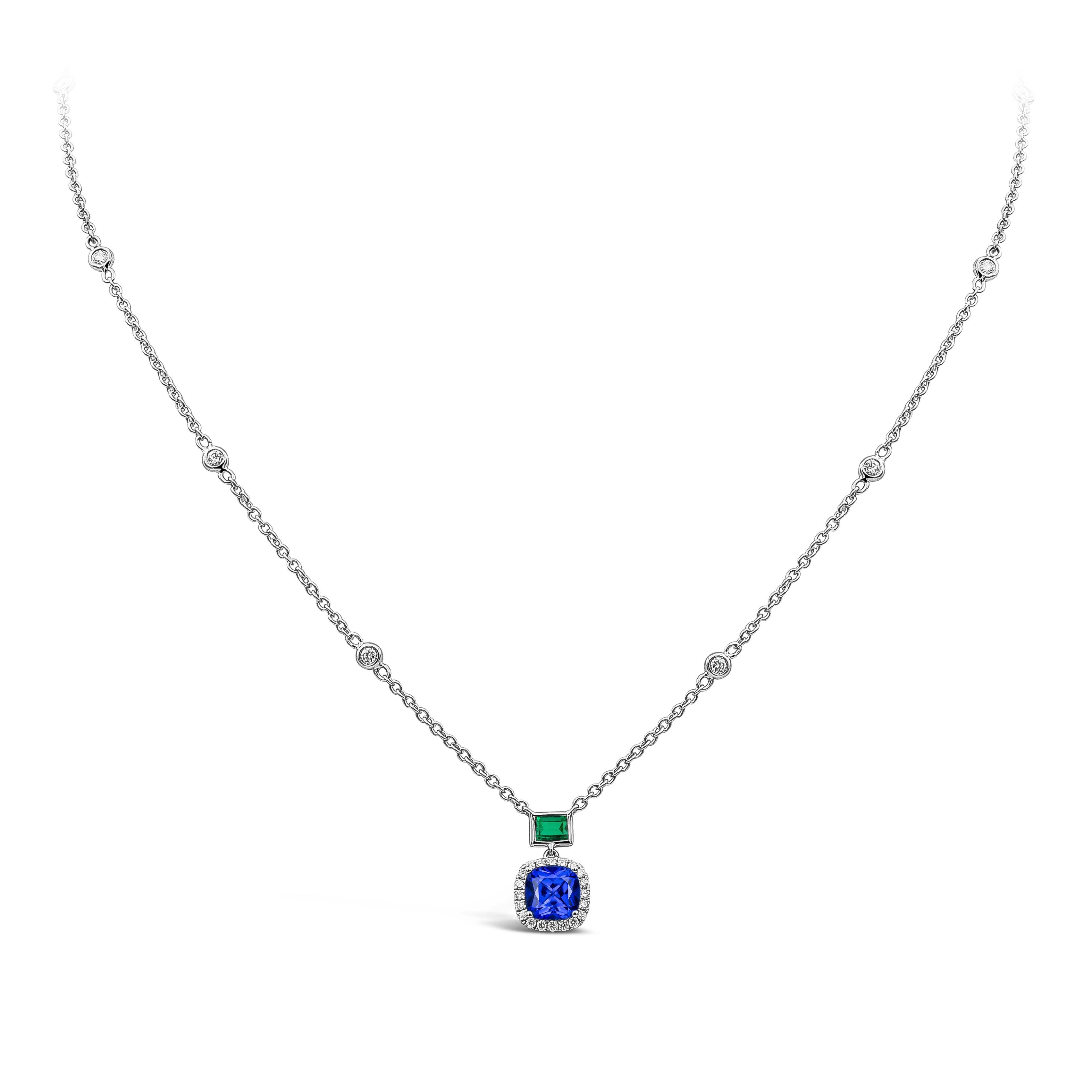 A color-rich and simple pendant necklace showcasing a blue cushion cut sapphire set in a brilliant diamond halo. The sapphire halo is suspended on an emerald cut green emerald, attached to a chic diamonds by the yard chain. Made in 18k white