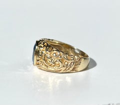 Cushion cut Blue Sapphire Set in 18k Gold Ring with Aztec Design shank