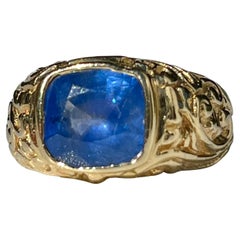 Cushion cut Blue Sapphire Set in 18k Gold Ring with Aztec Design shank