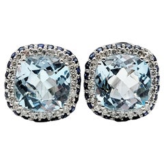 Cushion Cut Blue Topaz, Diamond, 
Sapphire Stud Earrings in 14 Karat White Gold
