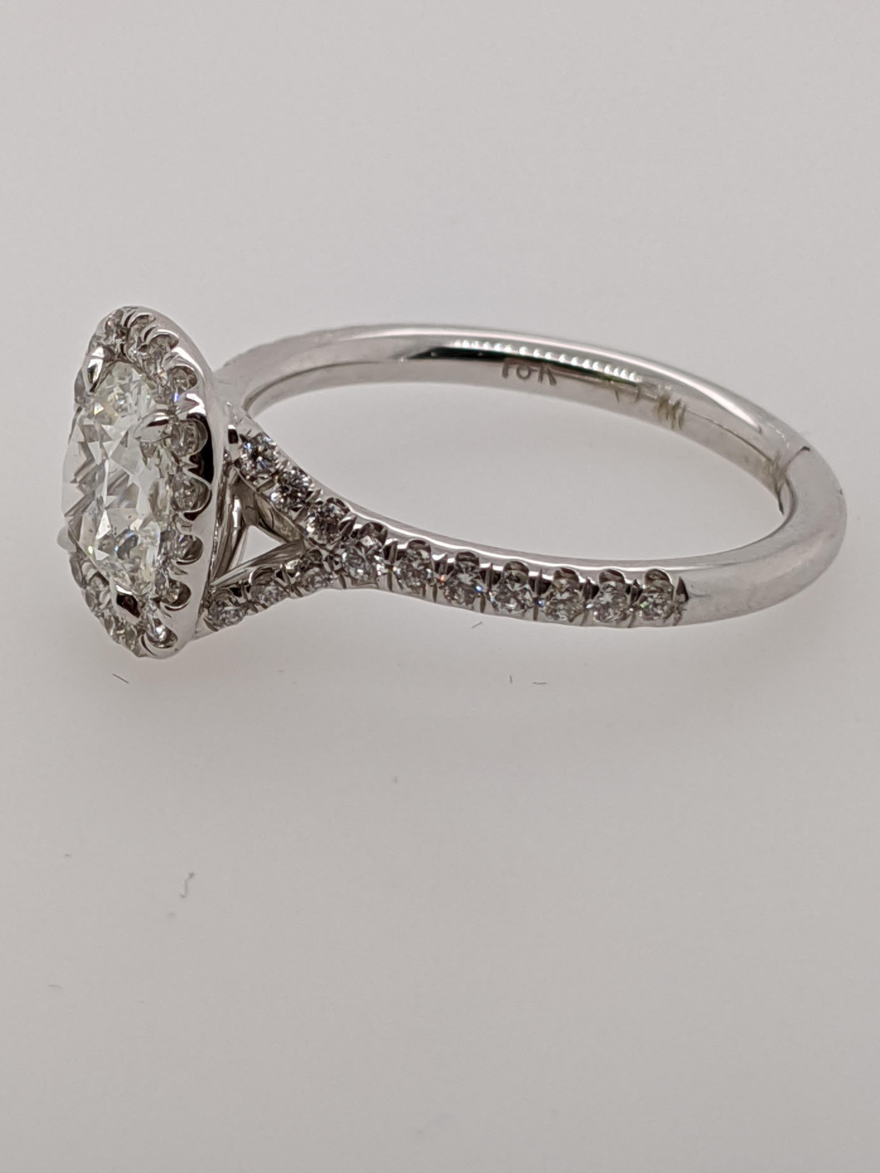 Classic 18 karat white gold split shank halo ring handmade in the United States.  Featuring a 1.02 carat J color I1 clarity antique style cushion with GIA grading report number 5201397767.

This listing has one of hundreds of cushion cut diamonds in