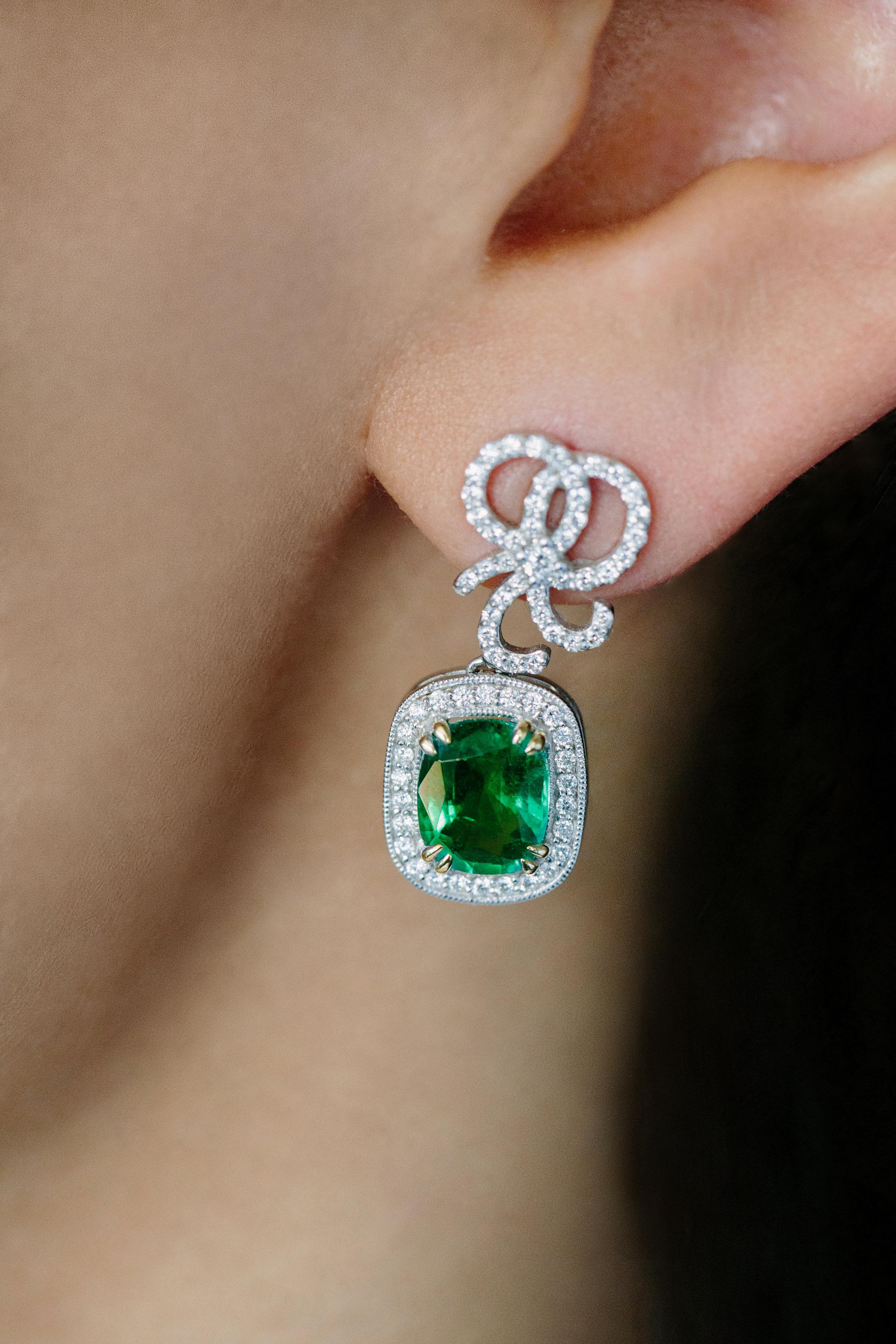Cushion Cut Emerald & Diamond Bow Earrings.

- 18K White Gold
- Cushion Cut Emeralds 3.03 carat total weight 
- Round Brilliant Diamonds 0.62 carat total weight 
- Ideal Cut
- F/G in Color
- VS in Clarity
