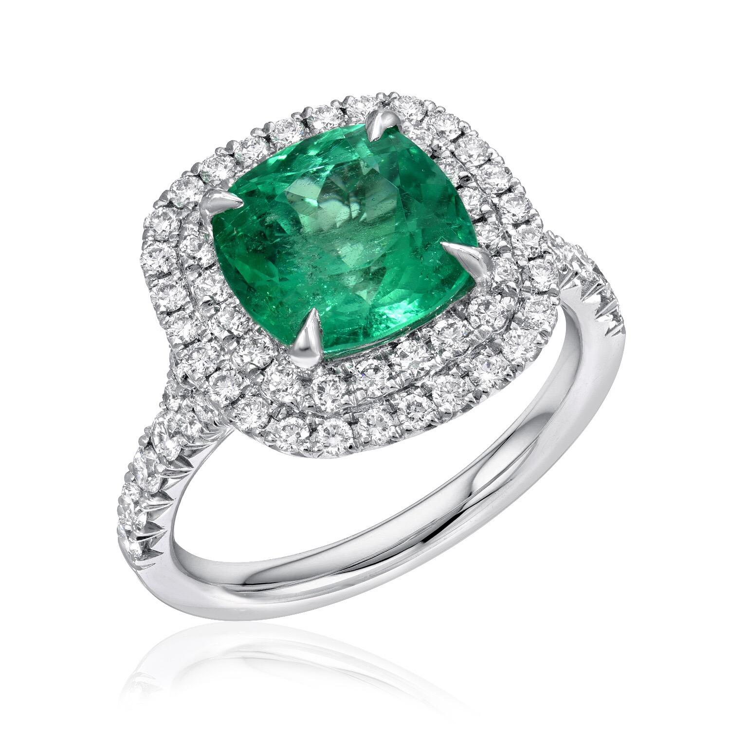 Colombian Emerald ring featuring a 2.82 carat cushion cut Emerald, surrounded by round brilliant micro pave diamonds weighing a total of 0.79 carats, in an 18K white gold engagement ring.
Ring size 6.5. Re-sizing is complimentary upon