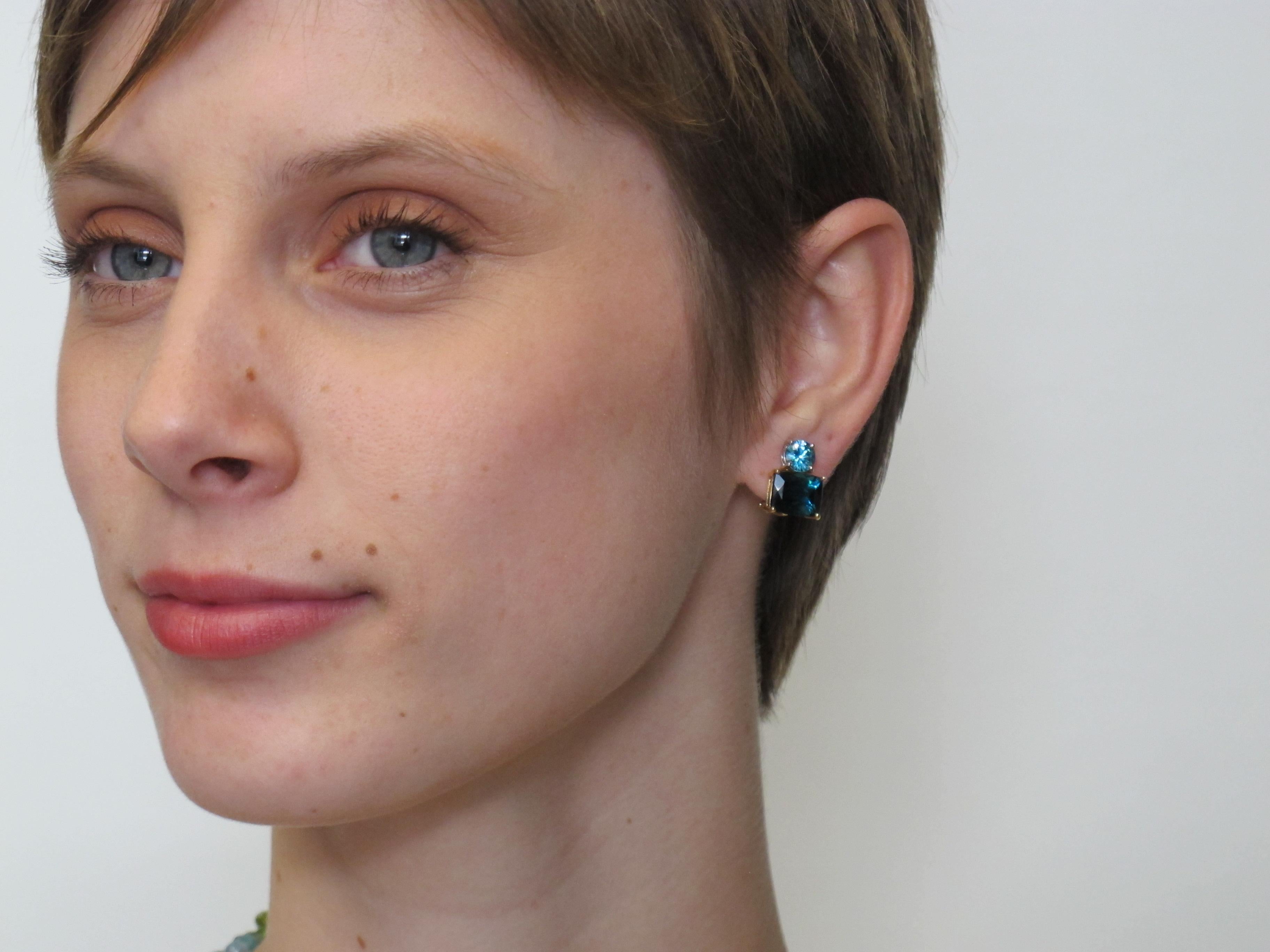 True indicolite blue tourmalines are very rare, especially in the exceptionally fine quality we used to make these earrings. Ours are beautifully matched,  deep greenish-blue and beautifully facetted in cushion cuts. The pair of  indicolites weigh a