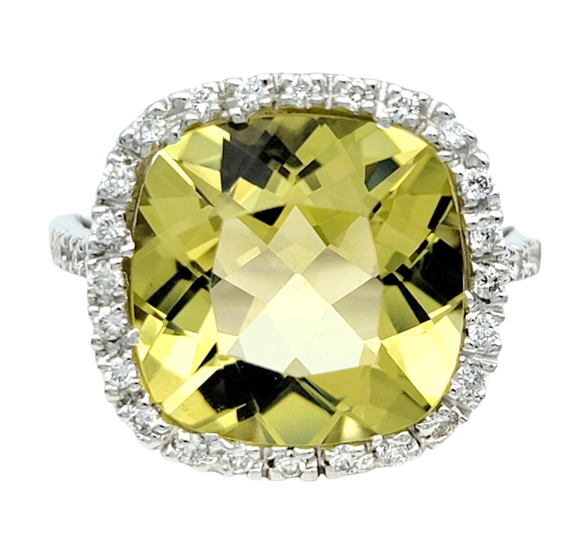 Ring size: 4.25 

Elevate your style with this stunning lemon quartz cocktail ring. The centerpiece features a captivating cushion-cut lemon quartz stone, encircled by a delicate halo of pave diamonds. Set in lustrous 18 karat white gold, this ring