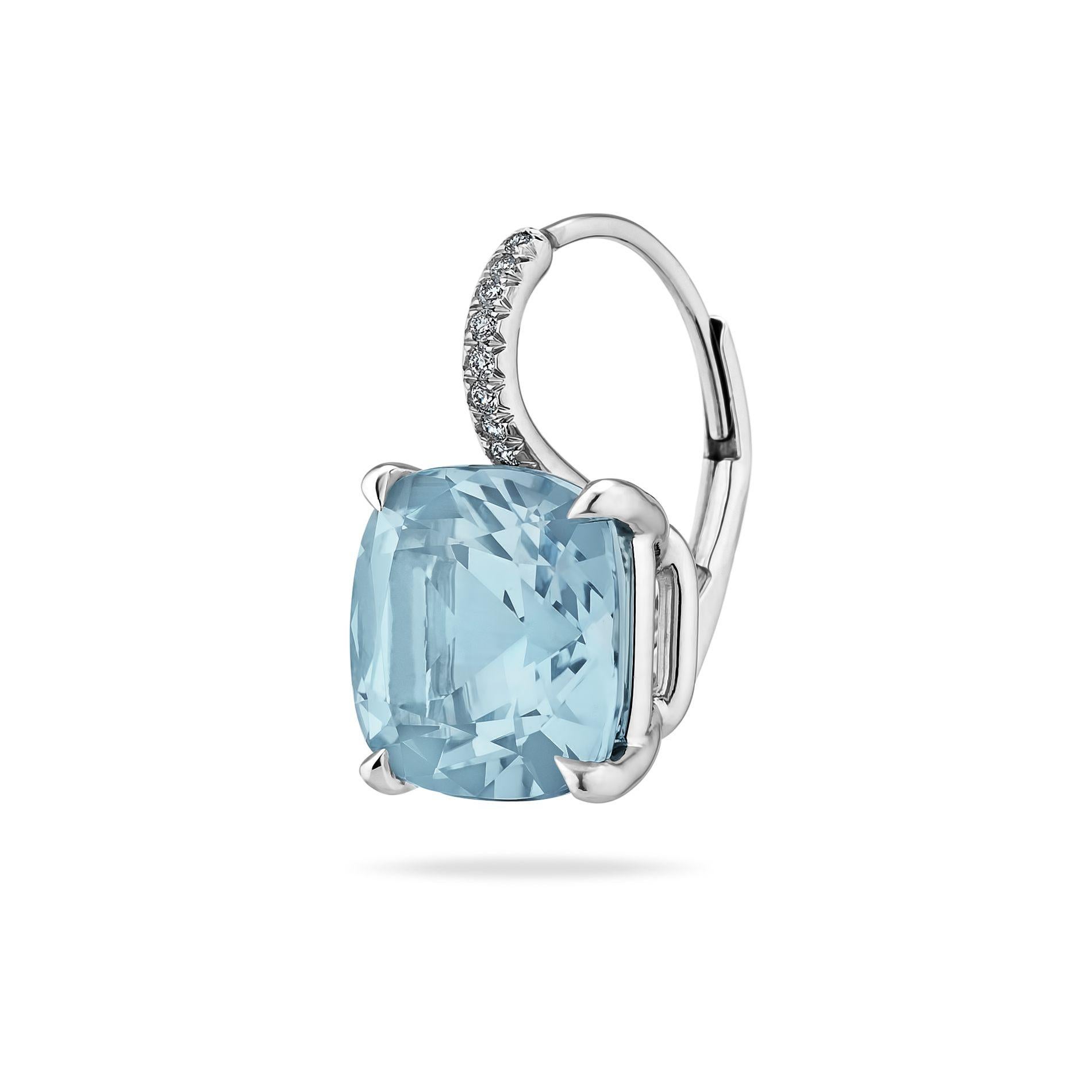 Blue and breezy, these medium size light blue topaz cushion cut gems, weighing a total of 9.36 carats, hang seductively from platinum diamond set wires.  Total diamond weight of .09 carats.  Lever backs.  5/8