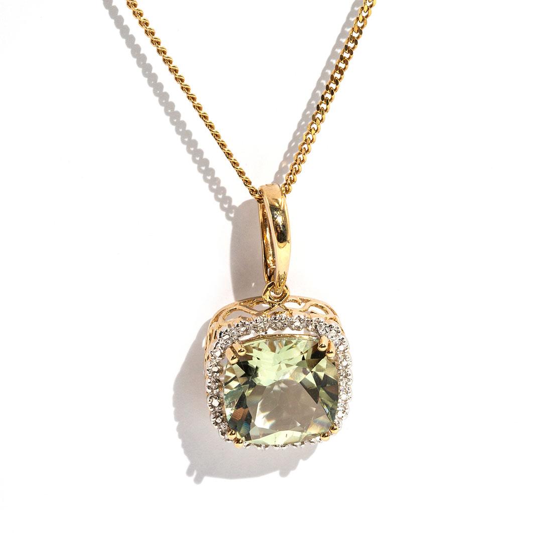 Forged in 9 carat yellow gold is this gorgeous vintage inspired pendant featurimg a bright natural cushion cut mint colour quartz gemstone and is surrounded by a halo border of carefully set diamonds. The Myka Pendant is threaded on a 9 carat yellow