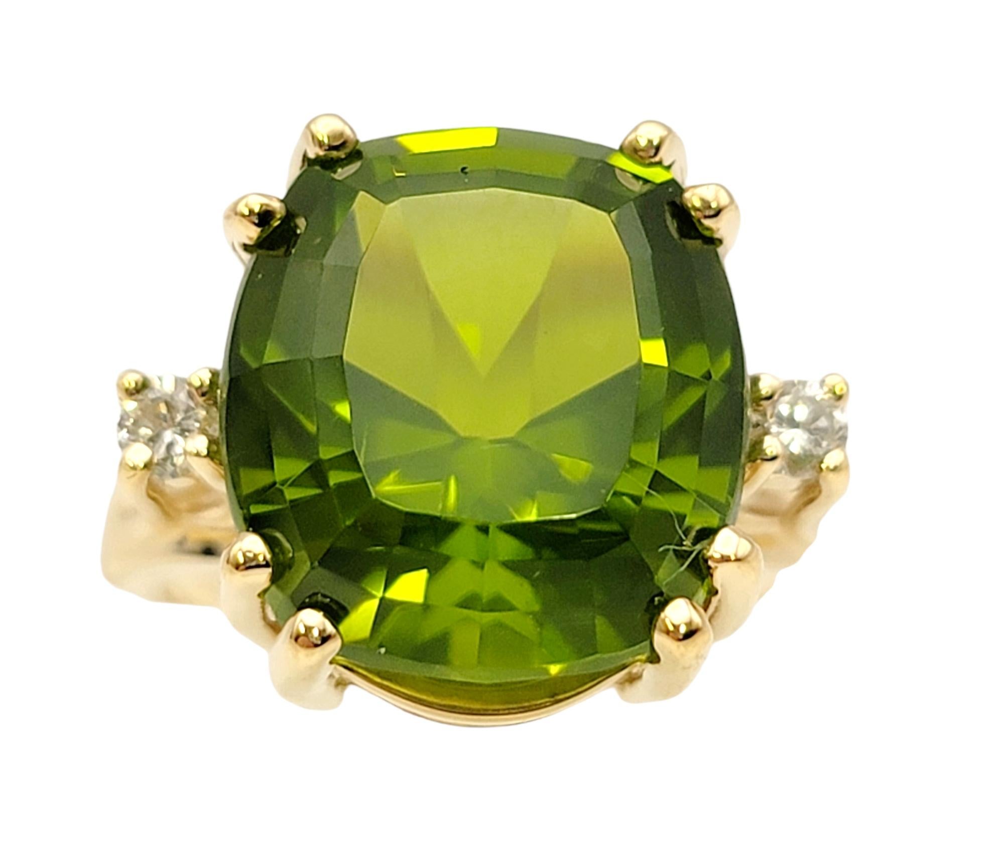 Ring size: 6

Bold and beautiful peridot and diamond cocktail ring. This eye-catching piece makes a big statement with its impressive size and bright color. The incredible cushion cut peridot stone is 8 prong set in 14 karat yellow gold and arranged
