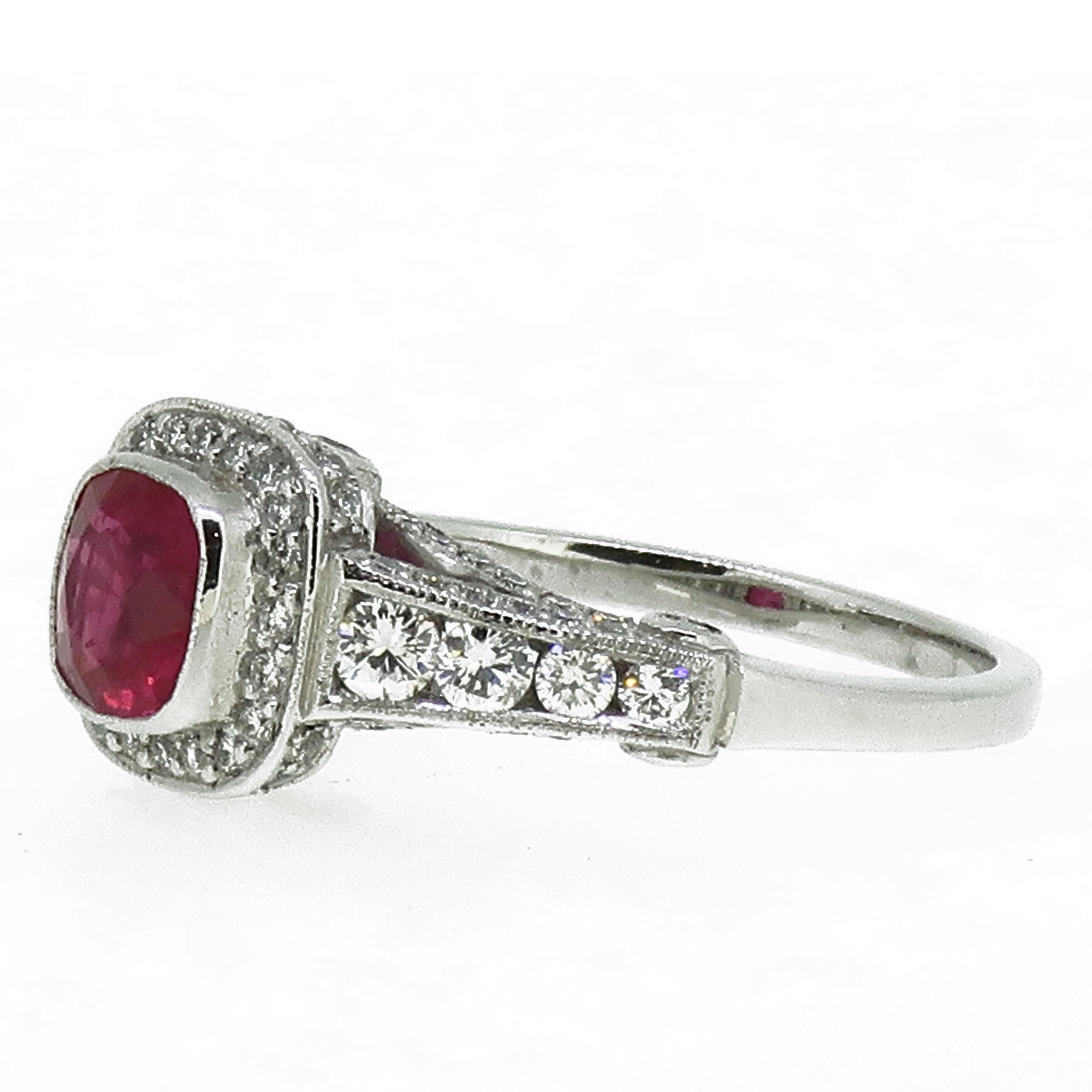Ruby and Diamond Cluster Ring 18 Karat White Gold

A dazzling cushion cut ruby red ruby & diamond cluster ring. Central cushion cut ruby framed by a border of small but super sparkly brilliant cut diamond, further diamonds around the head and also