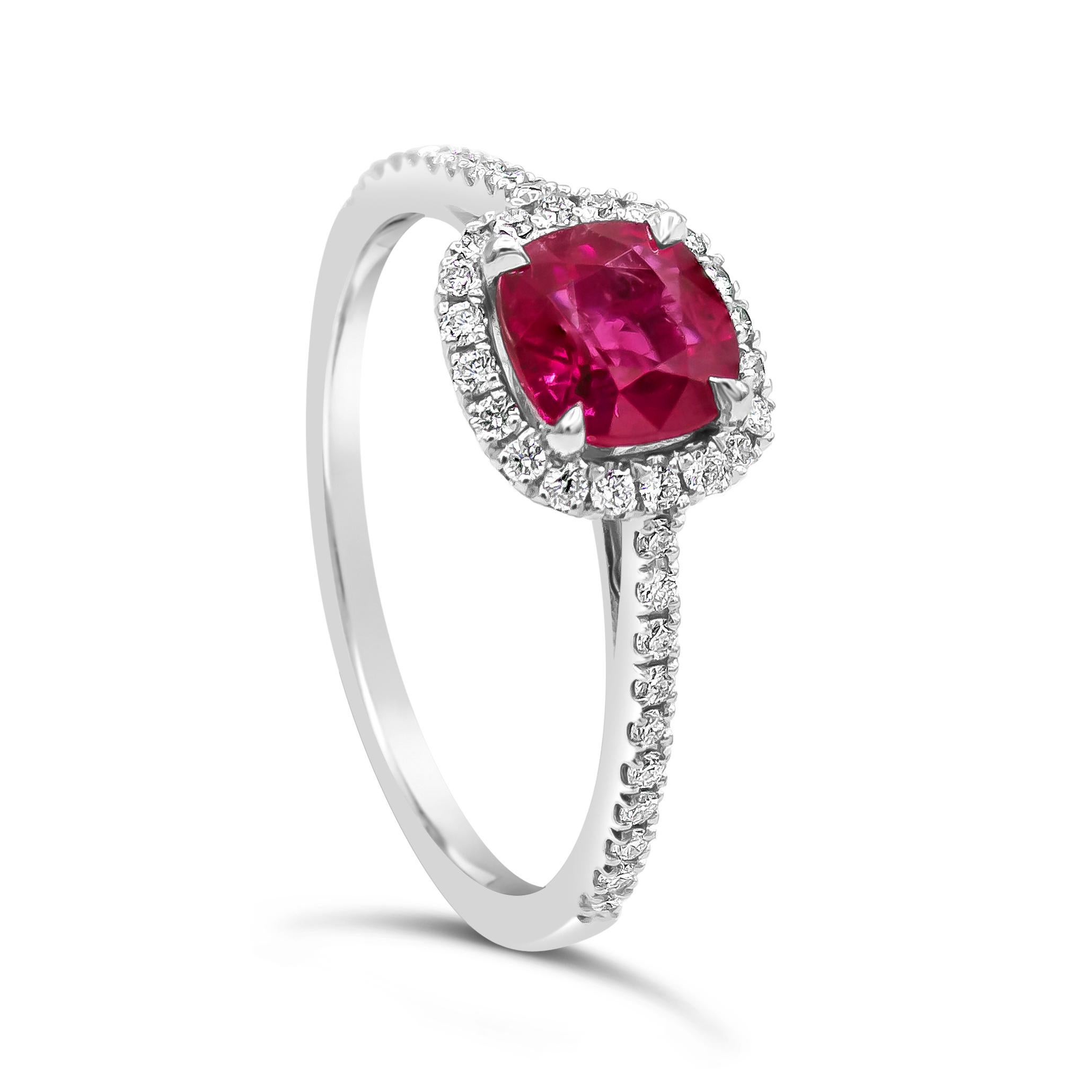 Showcases a cushion cut ruby weighing 1.11 carats, surrounded by a single row of round brilliant diamonds in a seamless halo design. Set in a thin 18 karat white gold band accented with diamonds. Diamonds weigh 0.24 carats total.

Style available in