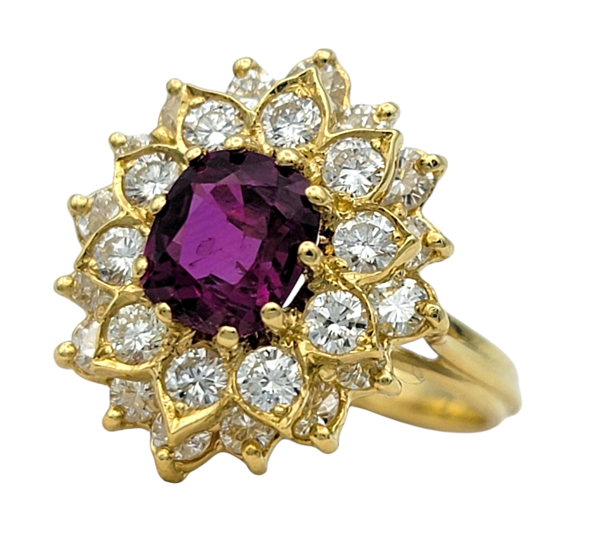Ring Size: 5.75

This striking ruby and diamond ring radiates timeless elegance with its bold floral-inspired design. At the center, a cushion-cut red ruby is set within an elaborate 18 karat yellow gold setting, exuding warmth and luxury.