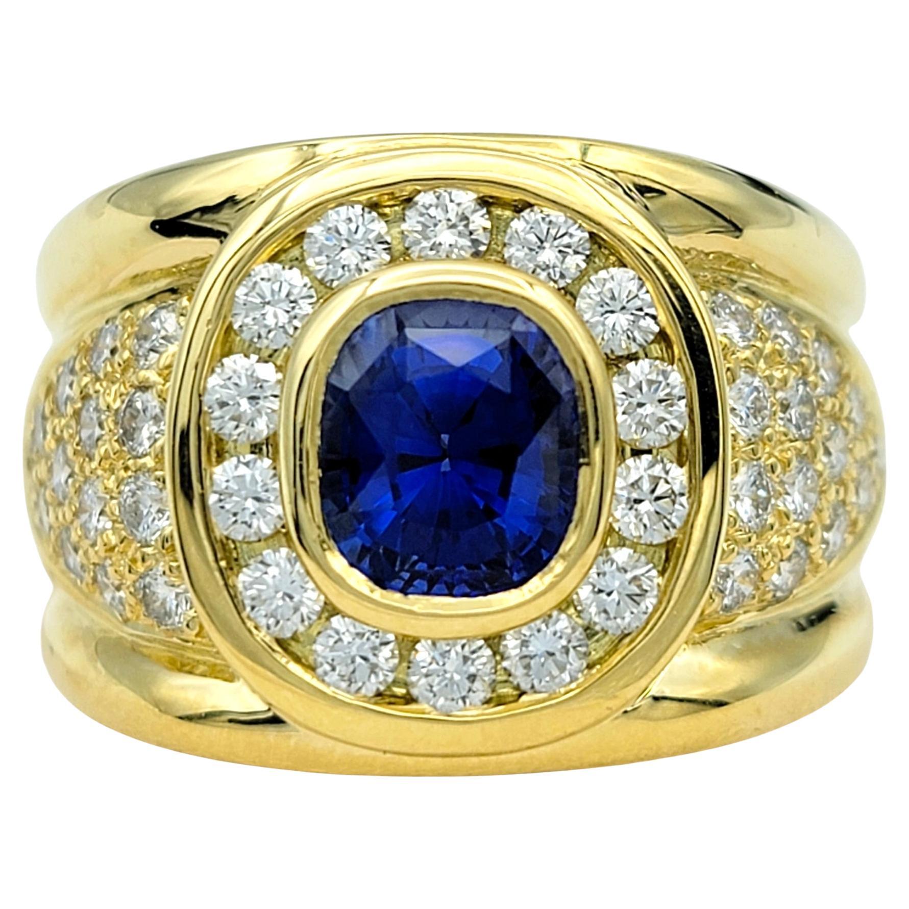 Cushion Cut Sapphire and Diamond Halo Wide Band Ring in 18 Karat Yellow Gold