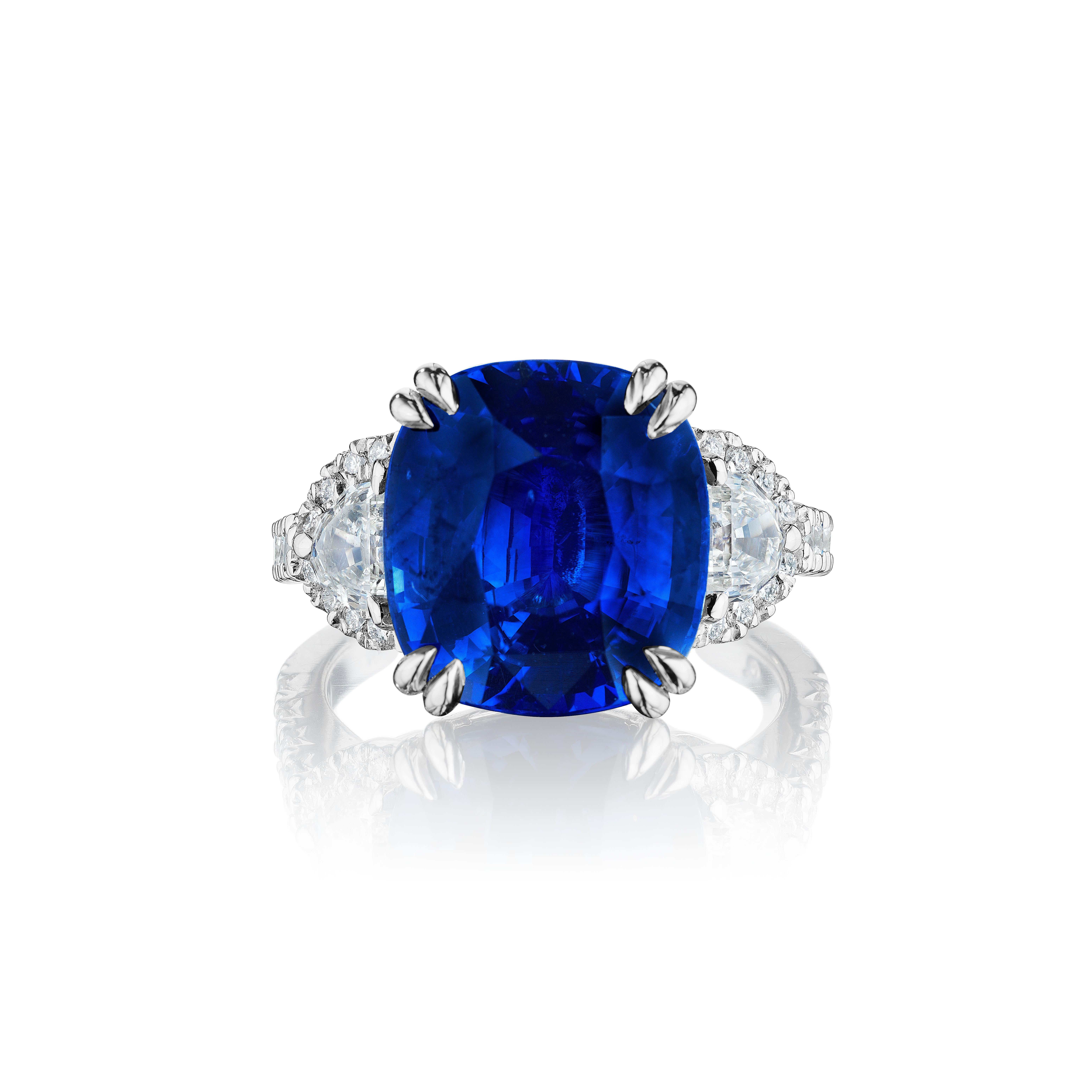 •	Platinum
•	Size 6.5
•	9.93 Carats

•	Number of Cushion Cut Sapphires: 1
•	Carat Weight: 8.86ctw
•	Color: Vivid Blue – Royal Blue
•	Certificate: GRS2020-012095

•	Number of Half moon Diamonds: 2
•	Carat Weight: 0.61ctw

•	Number of Round Diamonds: