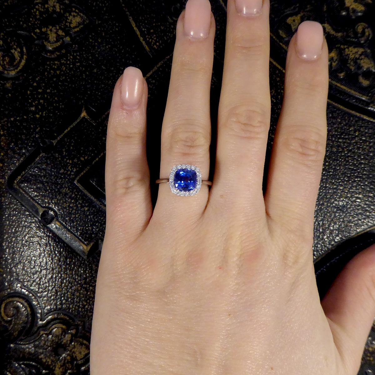 Cushion Cut Tanzanite and Diamond Cluster Ring in White Gold For Sale 1