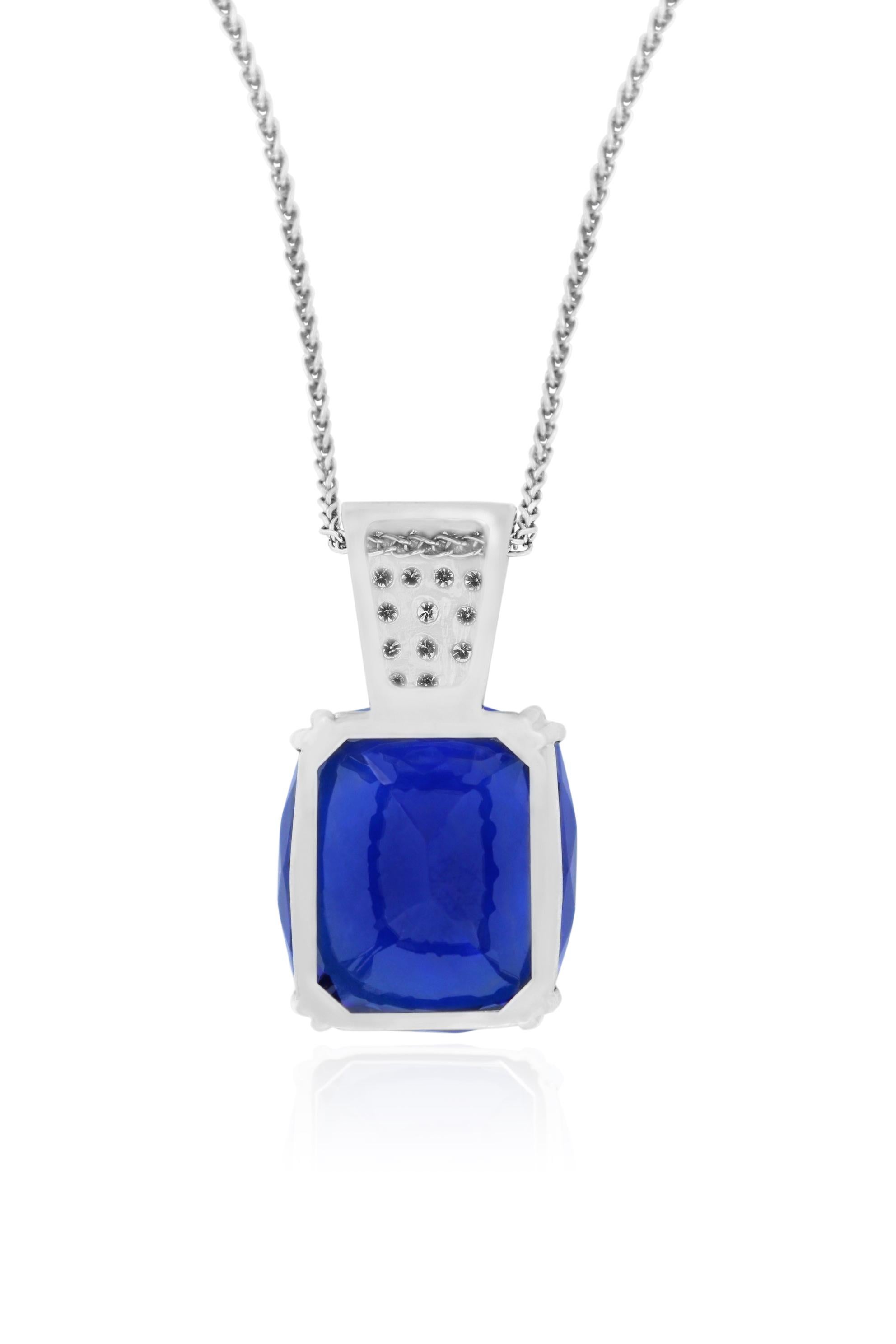 Material: 14k White Gold 
Center Stone Detail:  1 Cushion Cut Tanzanite at 53.15 Carats - AAA Cobalt Blue
Mounting Stone Details: 17 Brilliant Round White Diamonds at 0.61 Carats - Clarity: SI / Color
Chain Length:  18 Inches

Fine one-of-a-kind