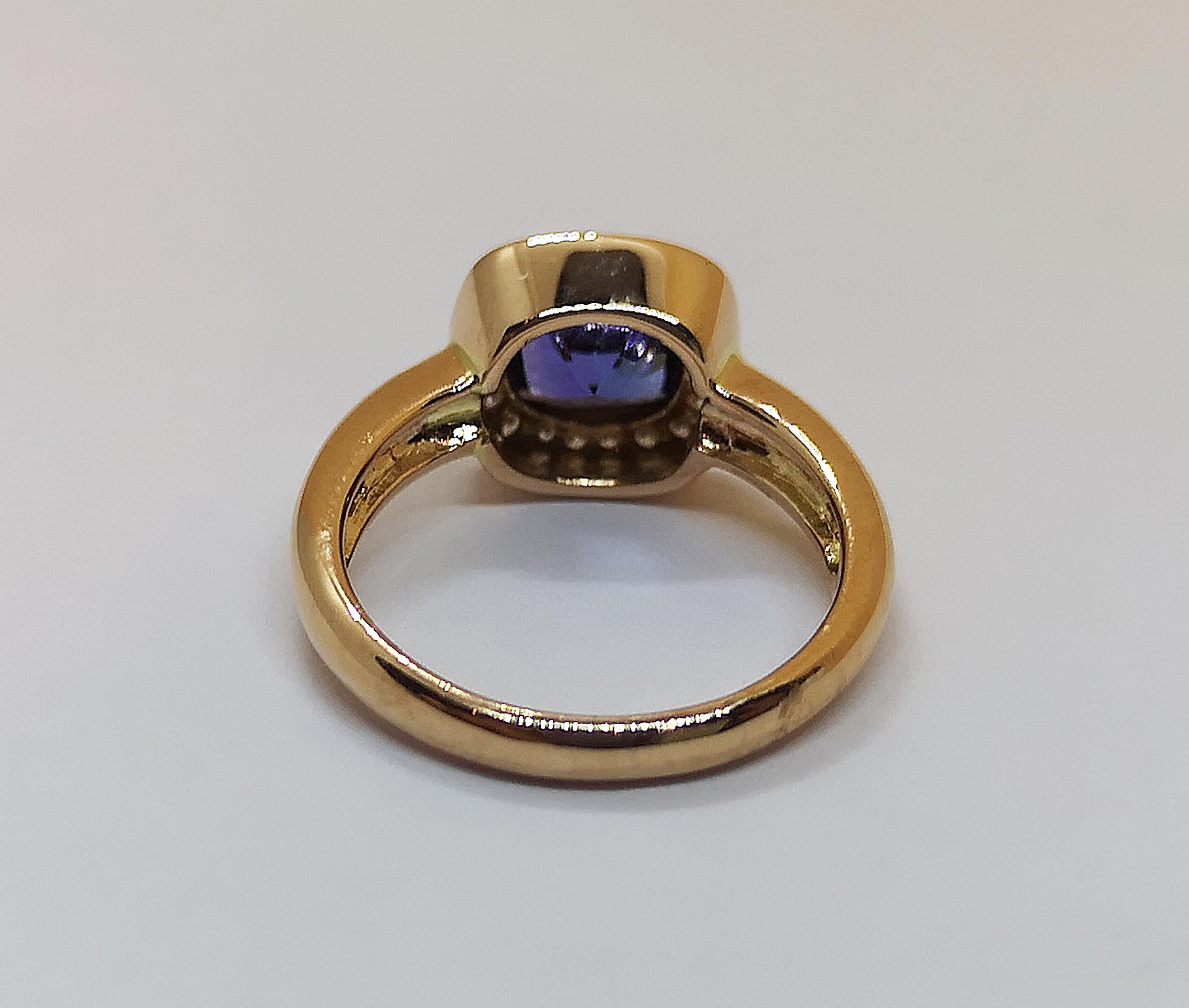 Contemporary Cushion Cut Tanzanite with Diamond Ring Set in 18 Karat Rose Gold Settings For Sale