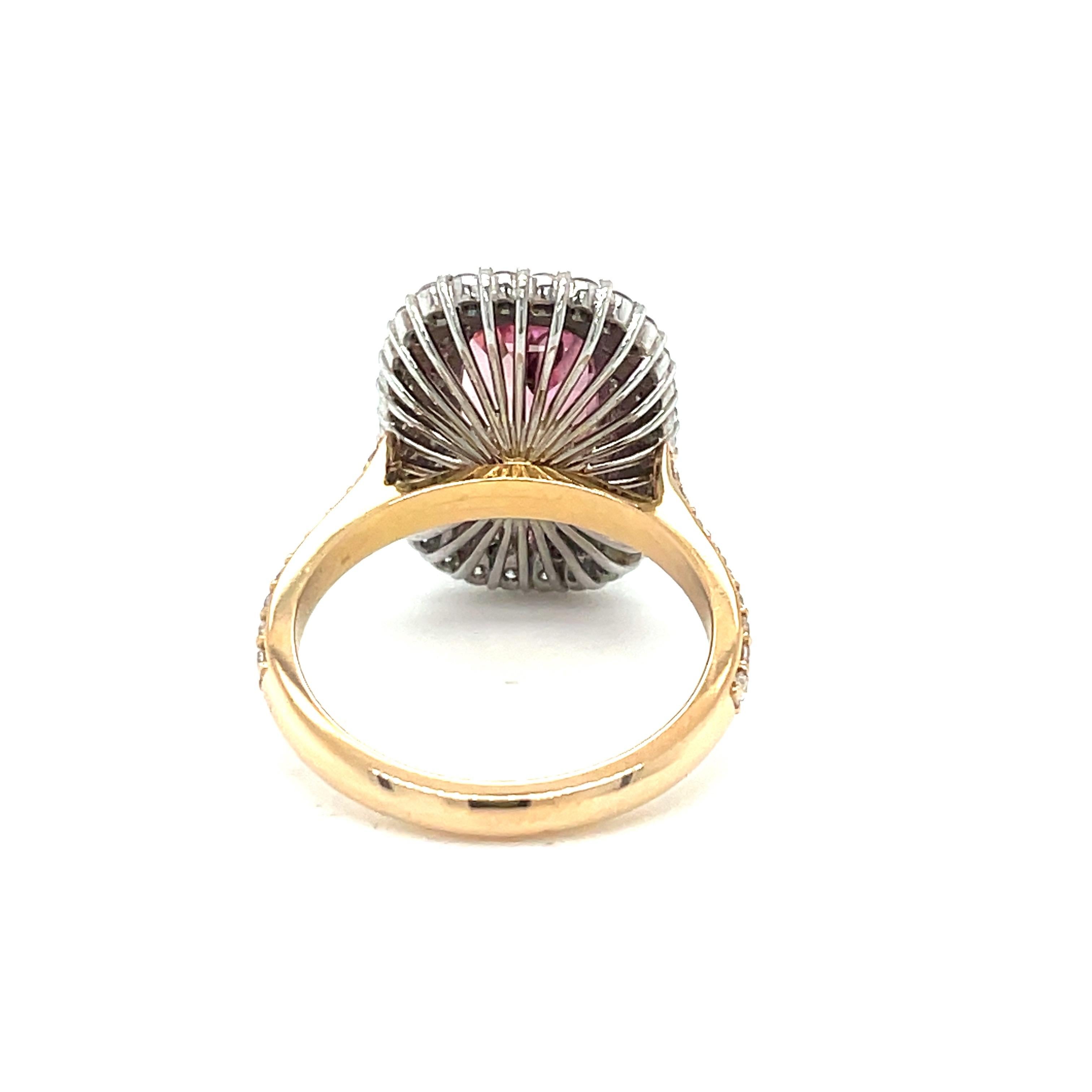
This beautifully proportioned tourmaline and double halo diamond ring in white and rose gold will compliment the wearer on any occasion. 
One rectangular Rubellite Madagascan Tourmaline measuring 13.4 x 7.50mm and weighing 4.72cts.
Surrounded by