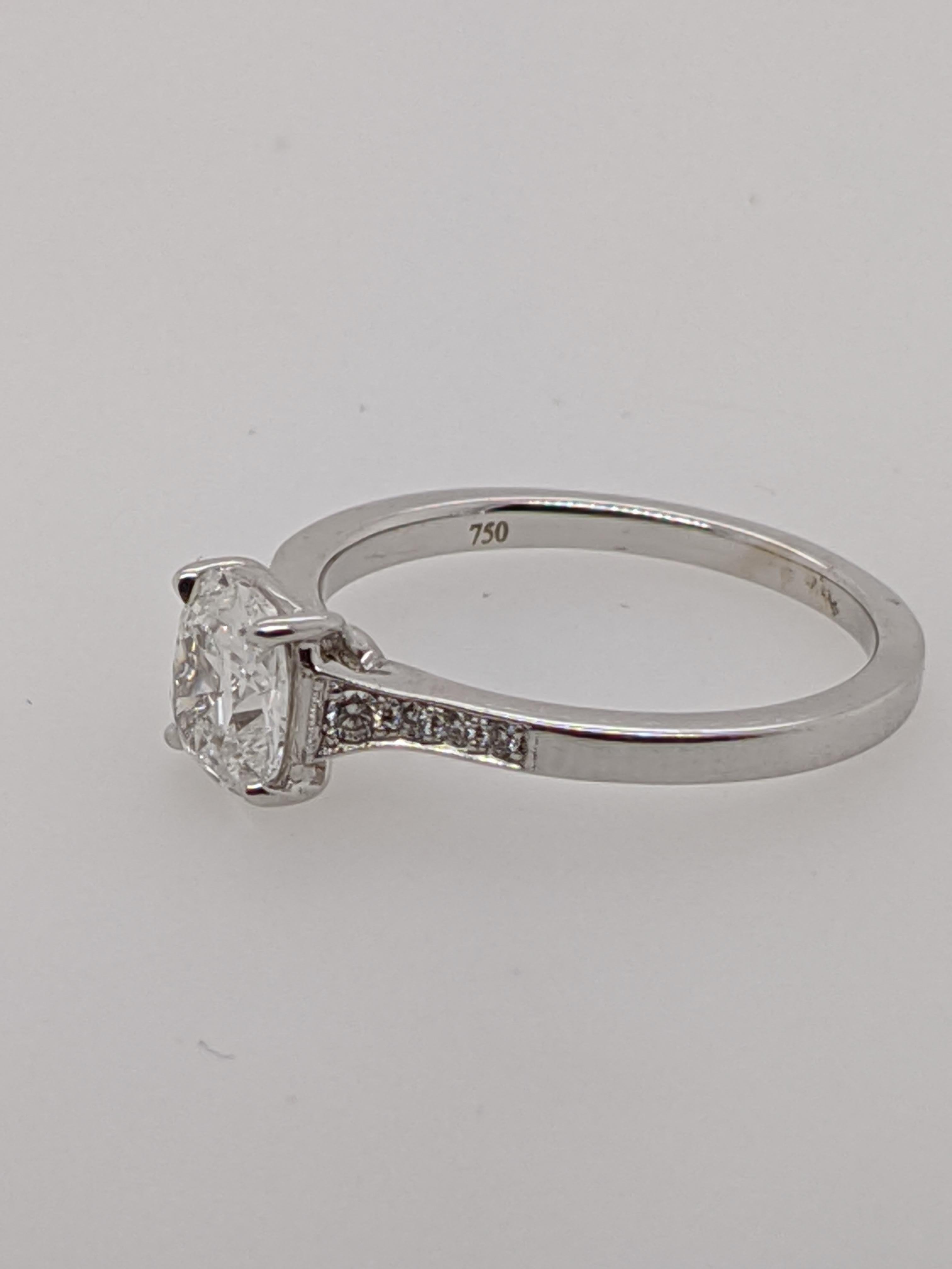 Classic 18 karat white gold vintage style ring handmade in the United States.  Featuring a .90 carat E, SI2  clarity antique style cushion with GIA grading report number 1172473450.

This listing has one of hundreds of cushion cut diamonds in our