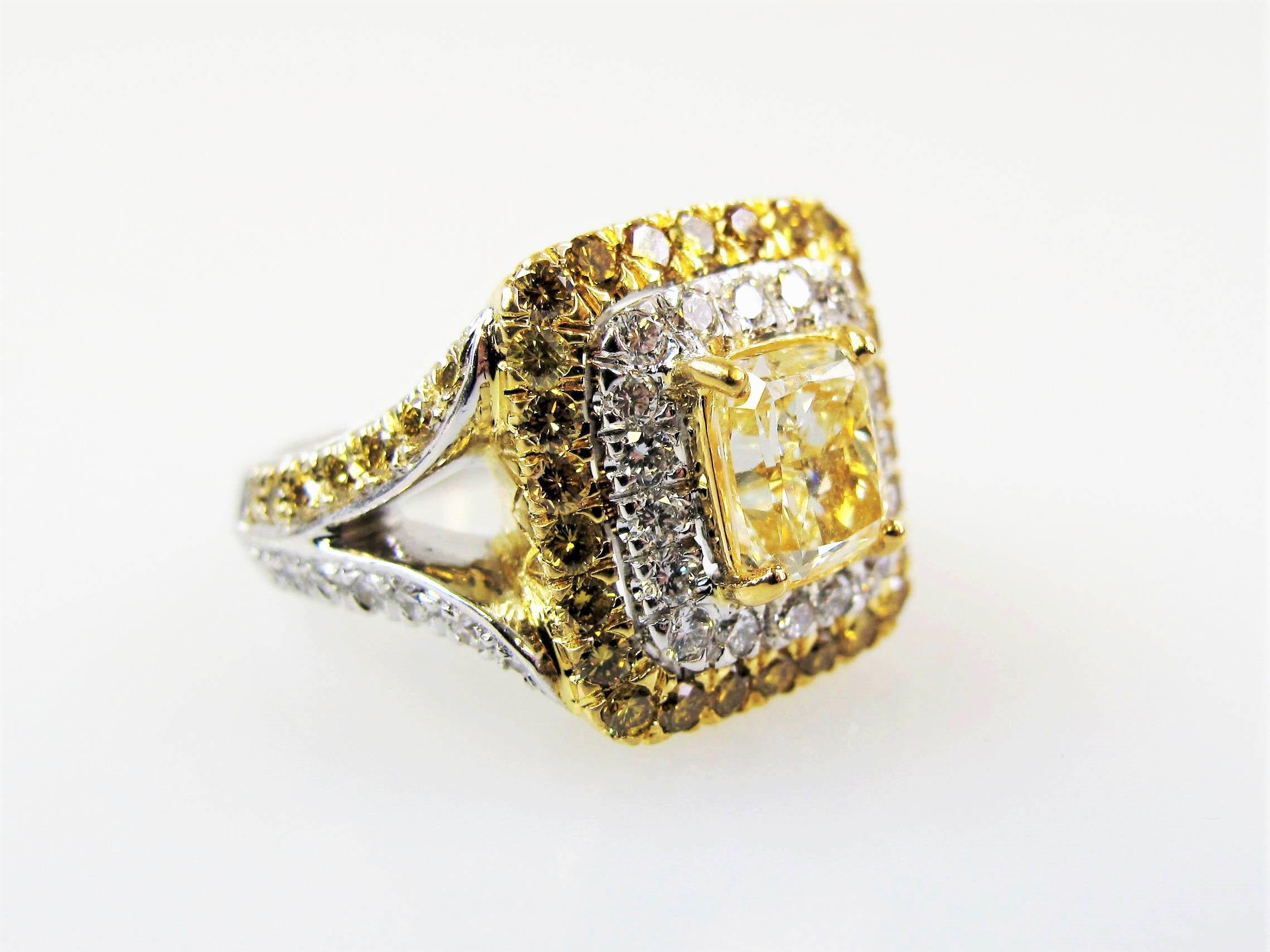This absolutely gorgeous double halo split shank diamond ring combines white and yellow diamonds in a unique design to showcase the color and brilliance of both.  This ring could be a stunning cocktail ring or a unique engagement ring for a lover of