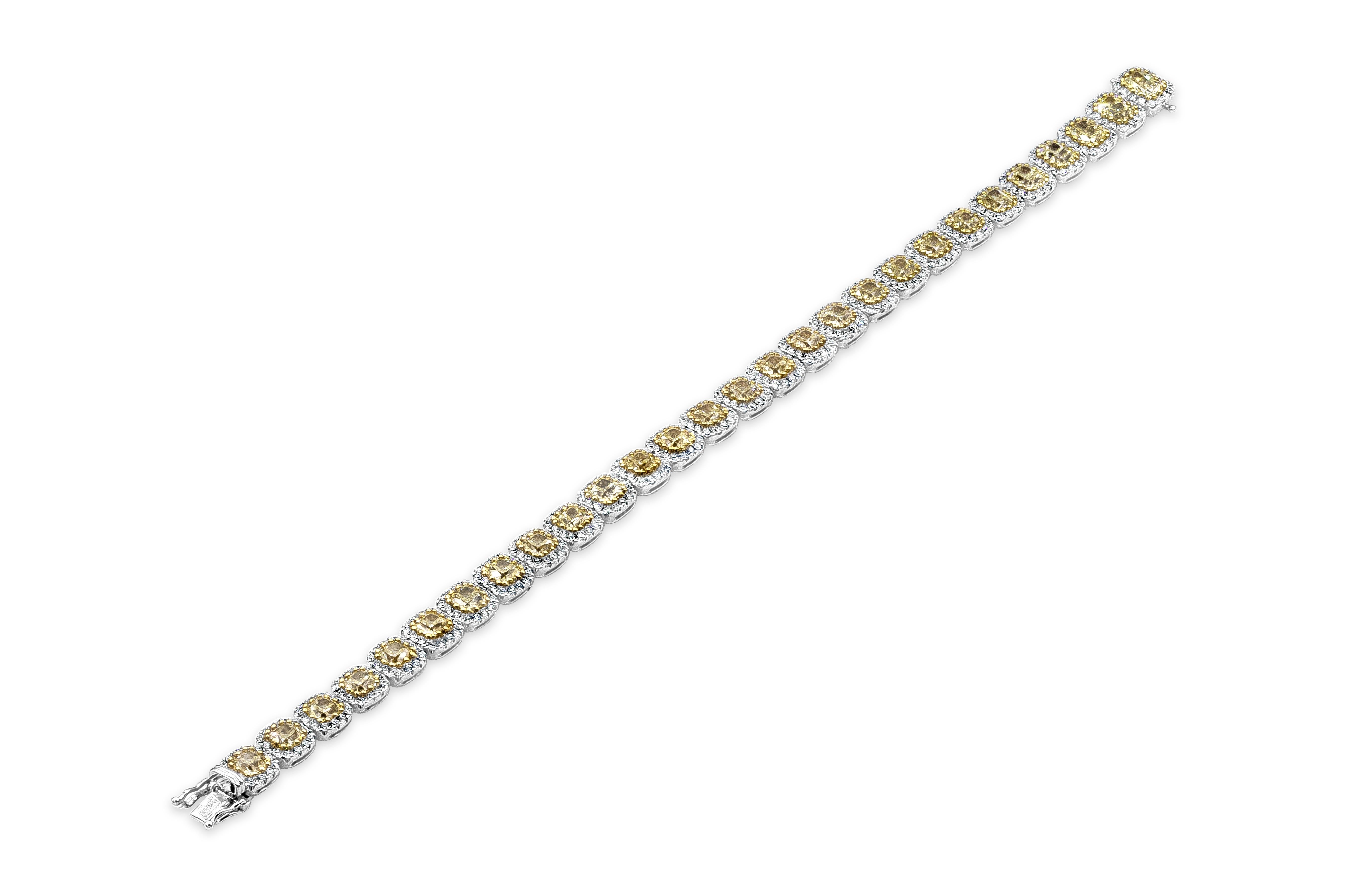 A unique and stunning piece of jewelry showcasing 9.53 carats of cushion cut yellow diamonds, set in a brilliant diamond halo. Accent diamonds weigh 2.49 carats total. Made in 18 karat white gold. 

Style available in different price ranges. Prices