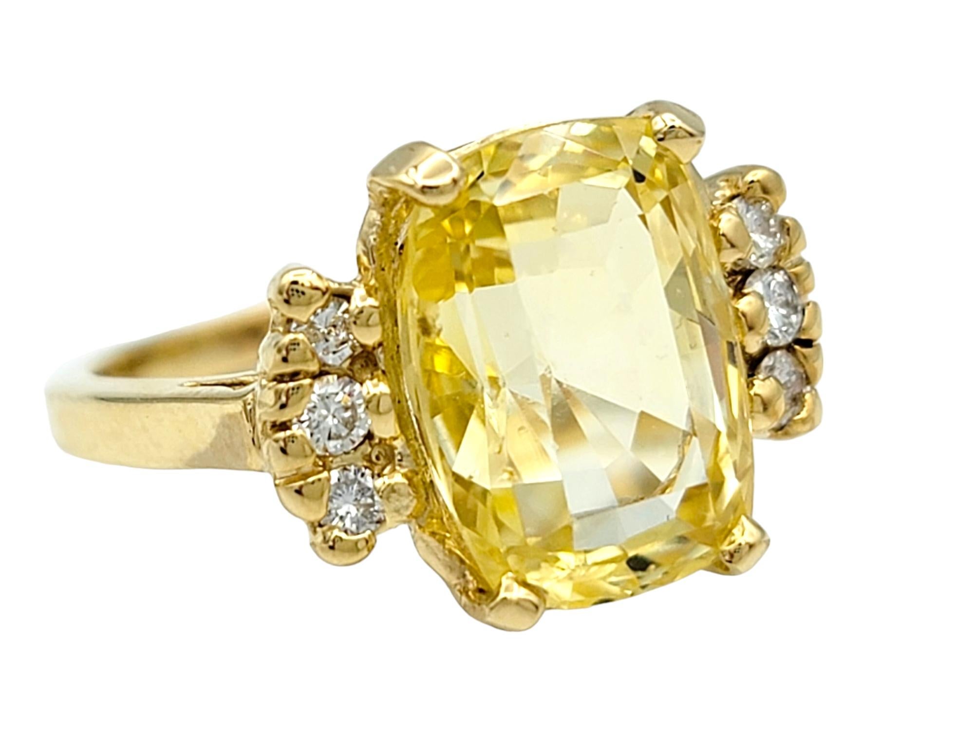 Ring Size: 5.25

Embrace the warmth and radiance of this cushion cut yellow sapphire ring, a true embodiment of elegance in polished yellow gold. The cushion-cut yellow sapphire, resplendent in its sunny hue, sits majestically as the centerpiece,