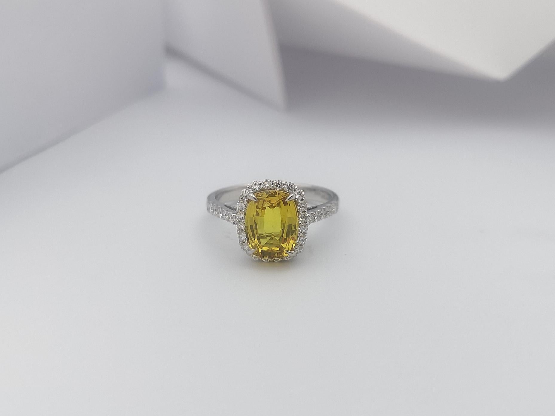 Cushion Cut Yellow Sapphire with Diamond Halo Ring Set in 18 Karat White Gold For Sale 1