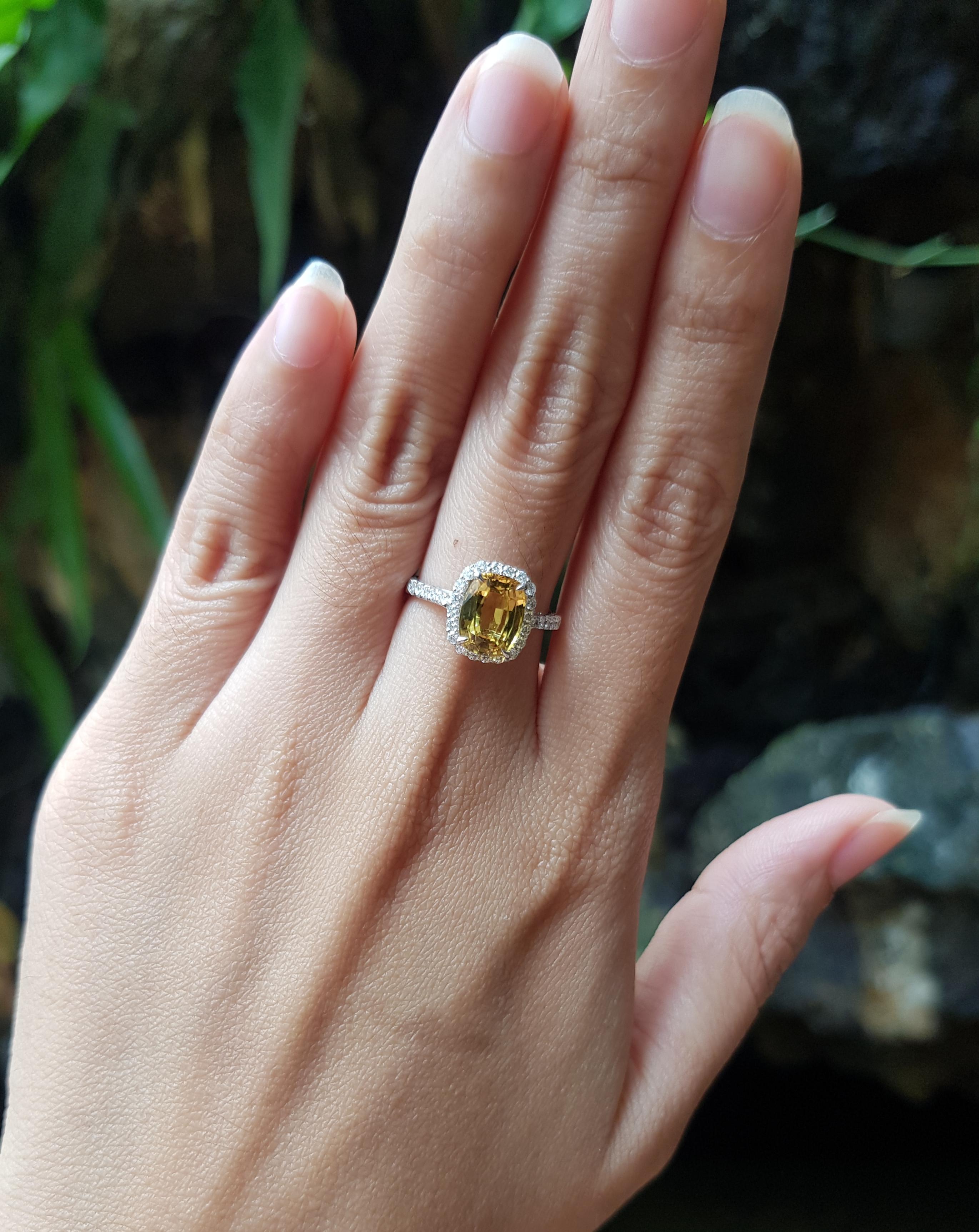 Yellow Sapphire 2.18 carats with Diamond 0.31 carat Ring set in 18 Karat White Gold Settings

Width:  0.9 cm 
Length: 1.1 cm
Ring Size: 52
Total Weight: 3.01 grams

Yellow Sapphire 
Width:  0.6 cm 
Length: 0.8 cm

