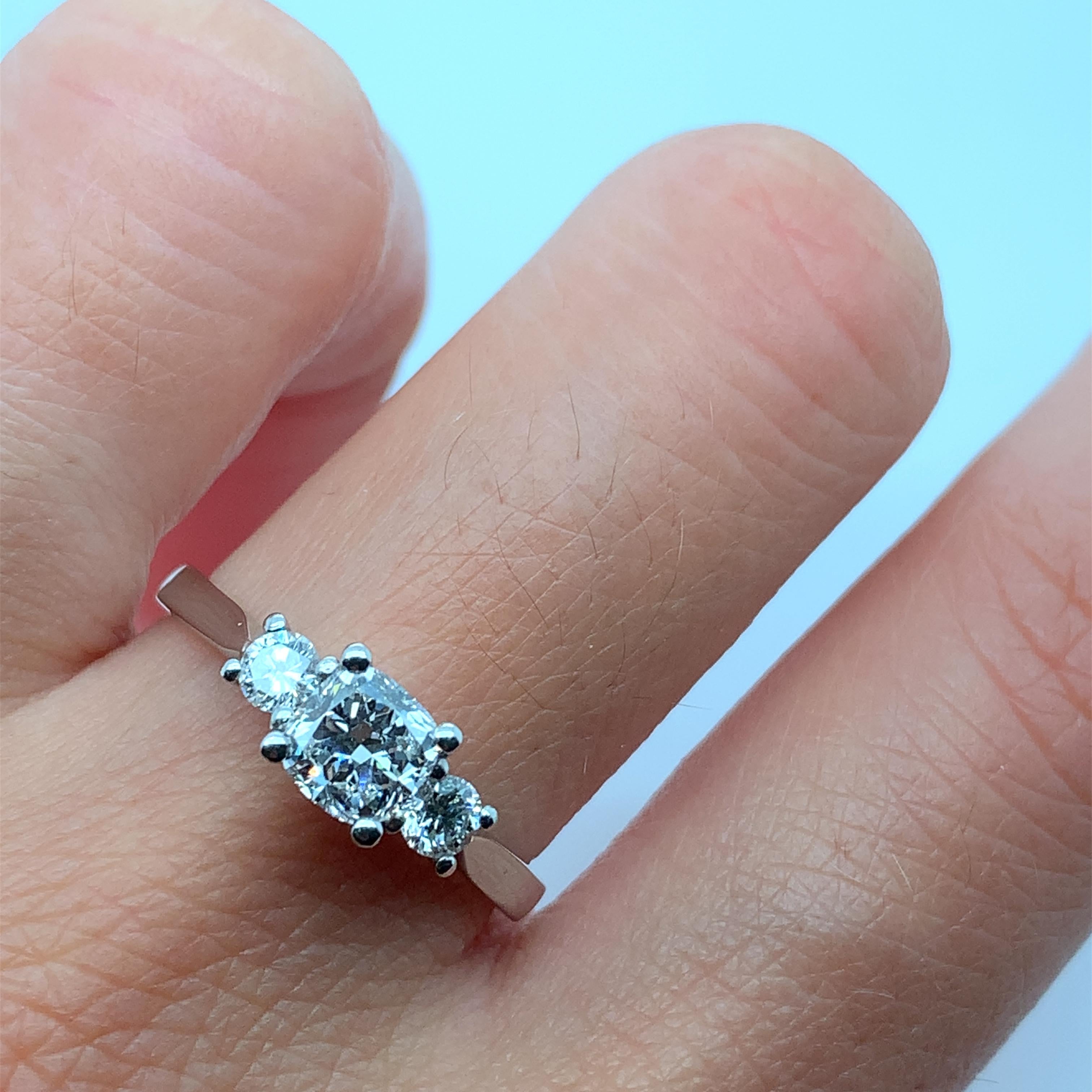 
1.40ct Trilogy three diamonds cushion and round diamond engagement ring in platinum.
Trilogy engagement ring.
Natural GIA certified diamond three stone ring.
Classic cushion and two round diamond trilogy engagement ring in platinum.
Cushion centre