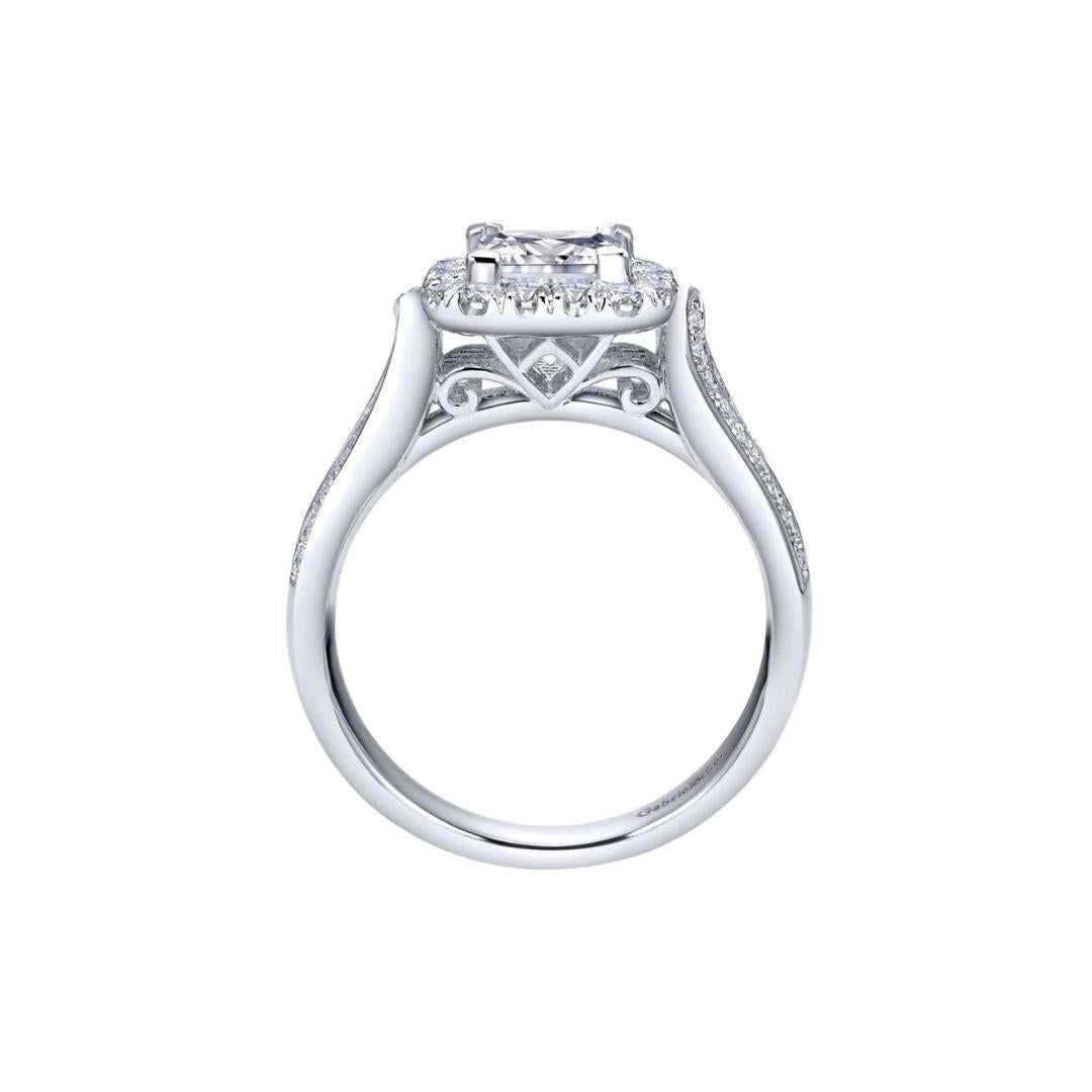 Cushion Diamond Halo Engagement Mounting in White Gold. Curved open space shoulders lead up to a milgrain halo with a vintage inspired spit shank design. Fits round cut, cushion cut, or princess cut diamond in the center. Center diamond NOT