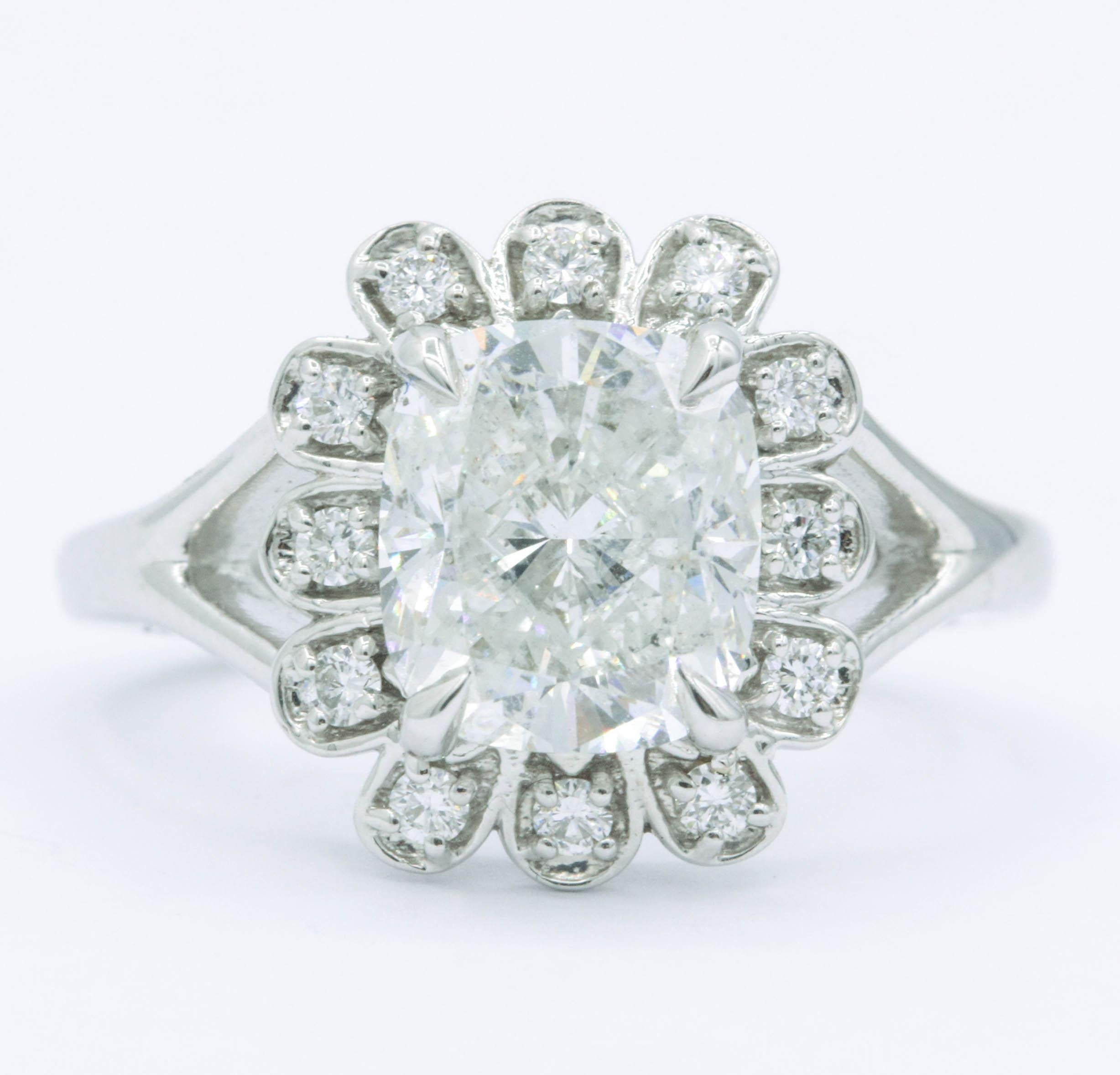 Cushion Diamond 3.03 Cts. 8 x 7.5 mm
Color G-H
Clarity SI3
12 Diamonds 0.19 cts. G-H SI 
14K White Gold
