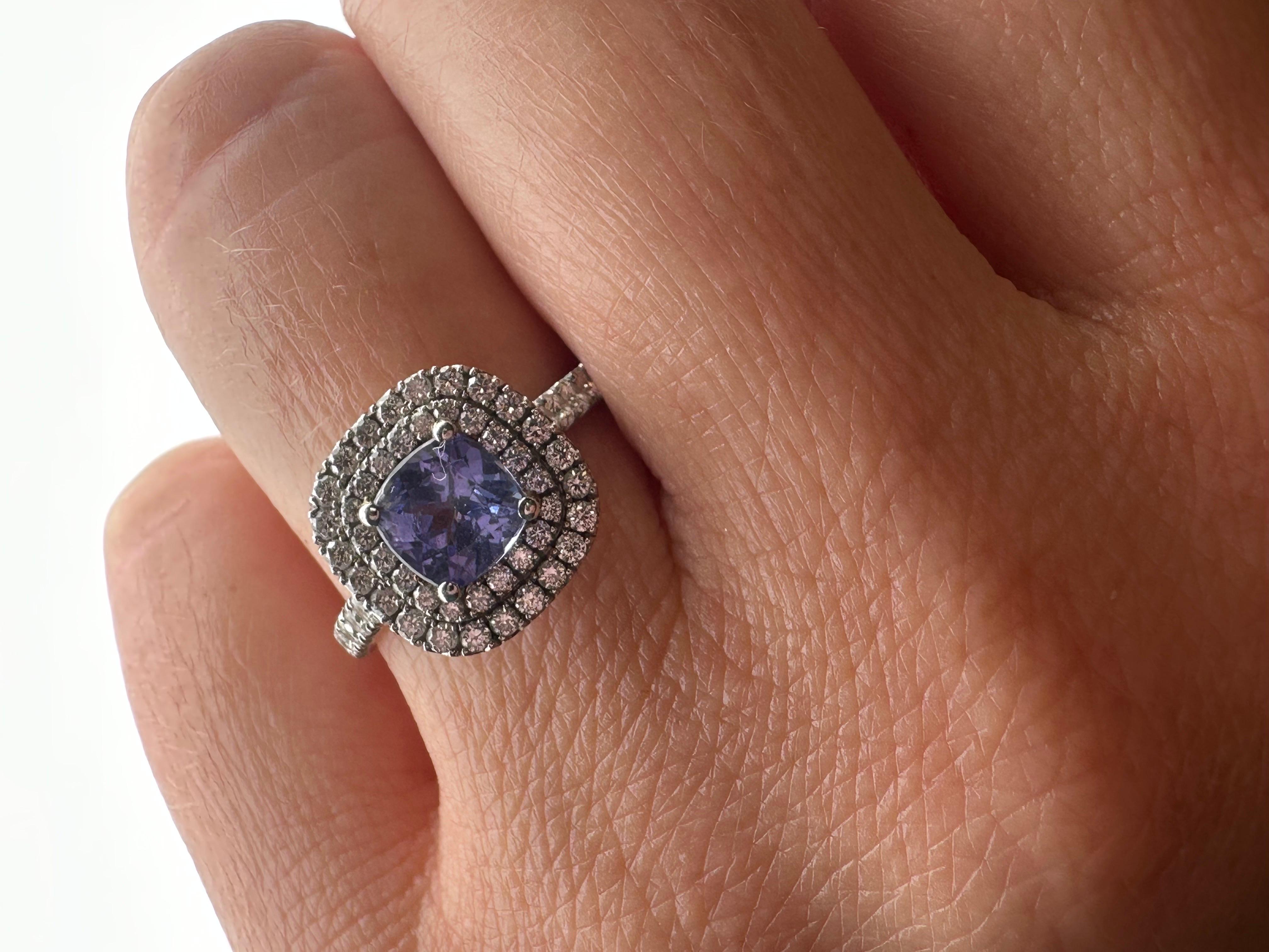 Stunnning modern engagement ring made with one cushion tanzanite and natural premium diamonds in 14KT white gold.

RE-SIZE IS FREE, PLEASE MESSAGE US YOUR FINGER SIZE!

Natural Tanzanite :
Carat: 1.12ct
Clarity: Slightly Included (Hard to see