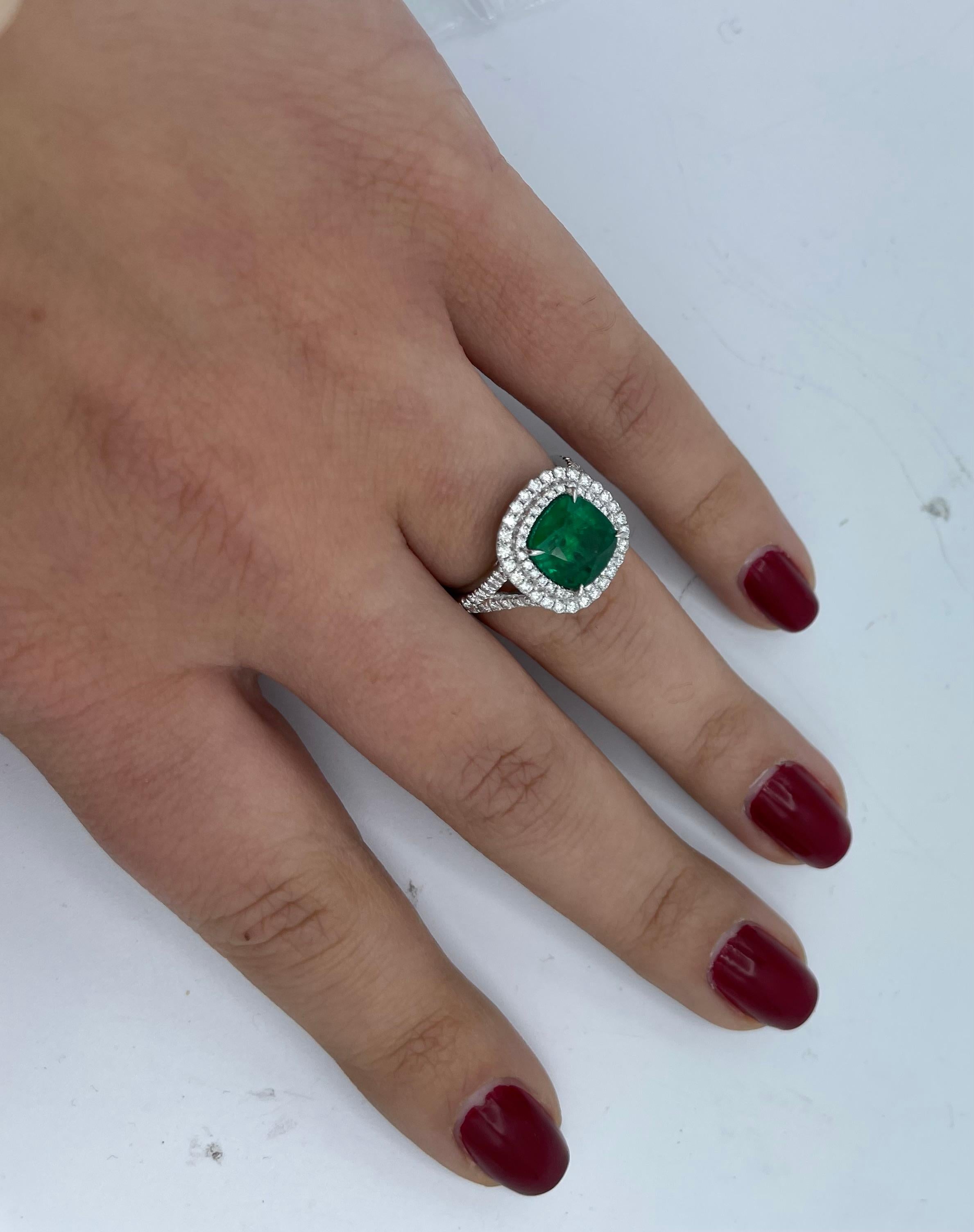 Contemporary Cushion Emerald Ring with Diamond Halo and Band