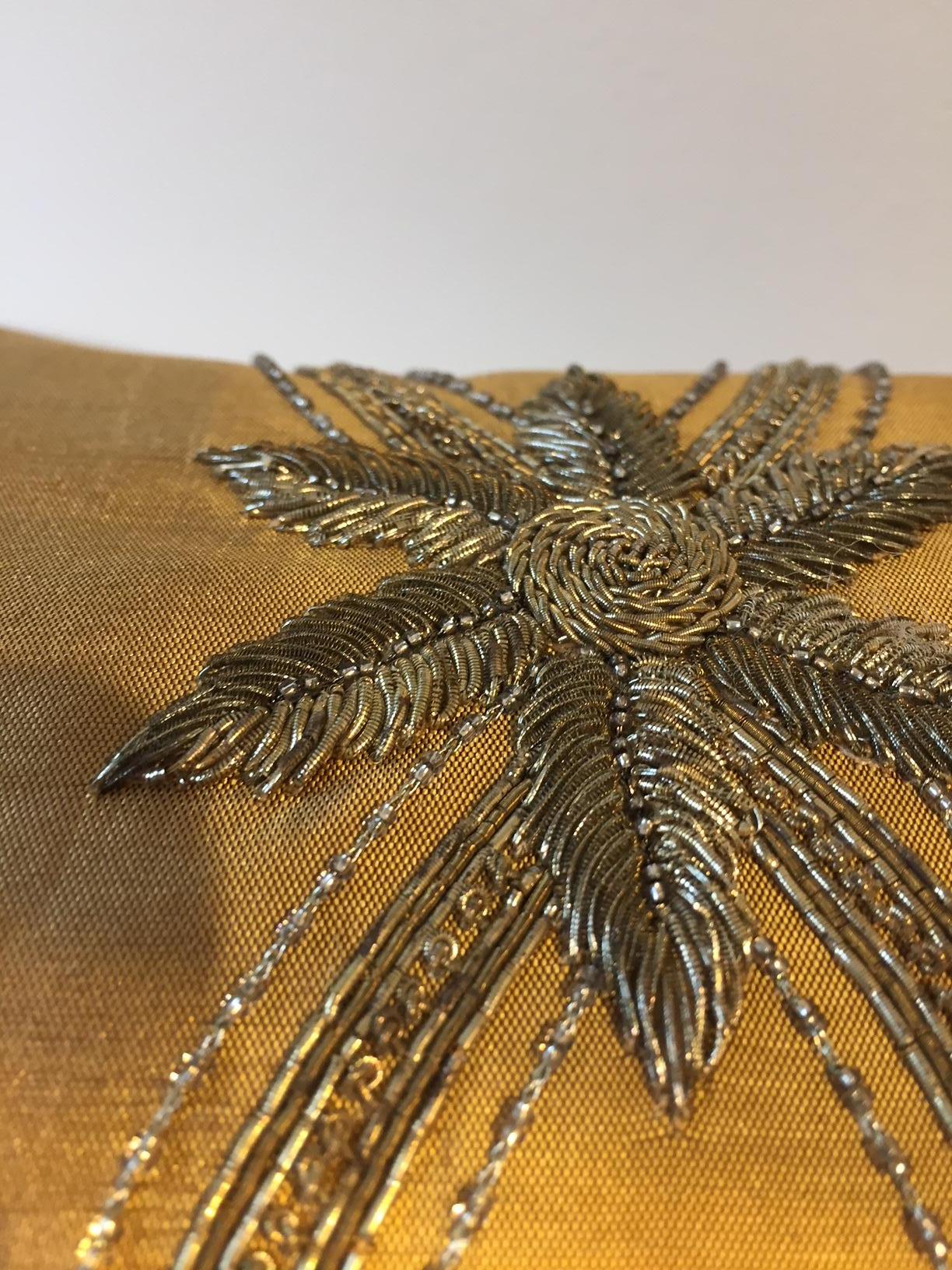Cushion in gold-ginger hand woven silk, hand embroidery with silver and gold thread work and very delicate beading, back side plain silk, the silk on the back shows crease marks,
Size: 20 x 30cm, concealed zip, cotton lining, feather inner.