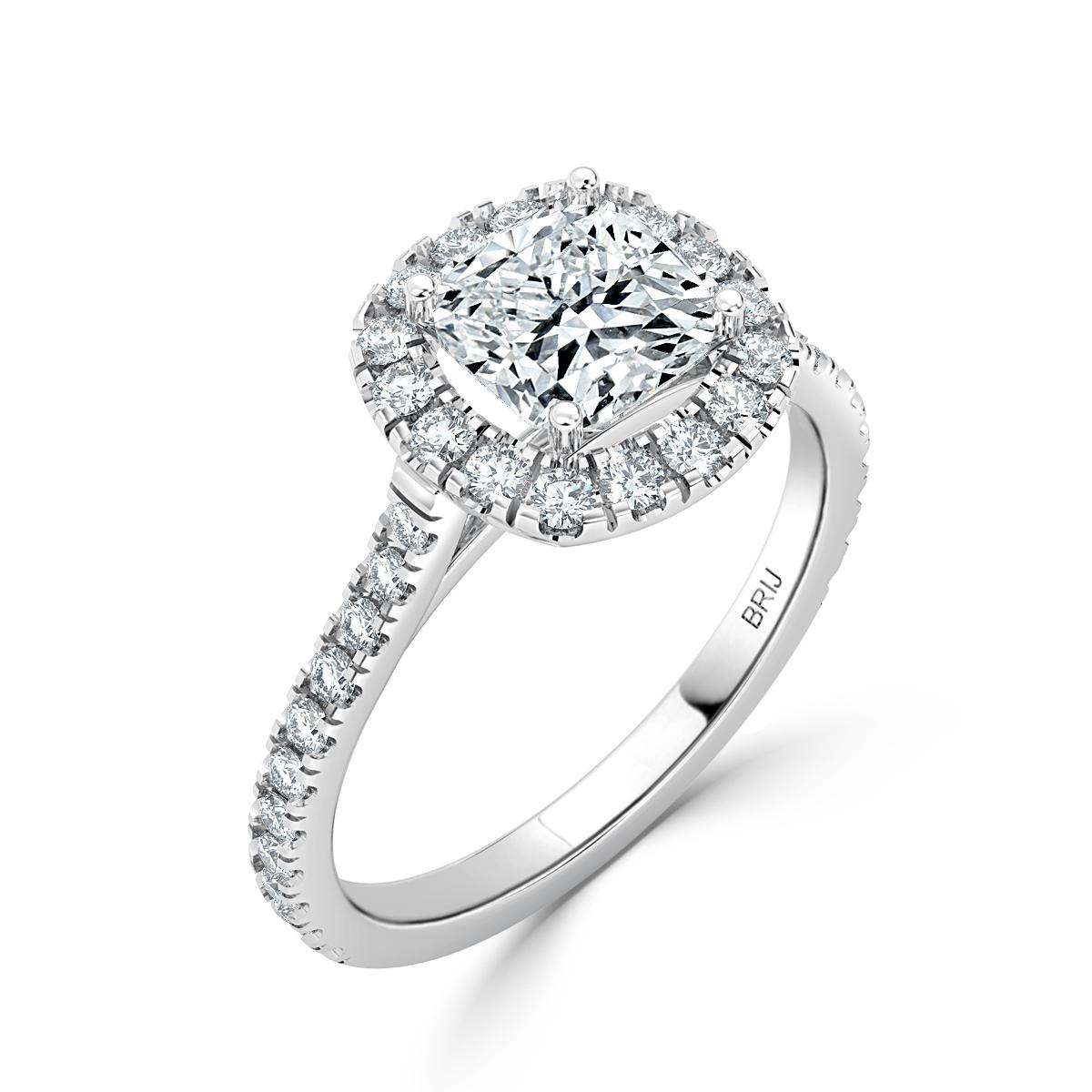 Simple, classic Diamond Halo engagement ring. Accented with 32 full cut diamonds along the shank  and Halo in a 18k White Gold setting. 
GIA certified round center stone 1.02 CT
Total Carat weight above 1.40 CT

GIA Certified Diamond Details
Weight:
