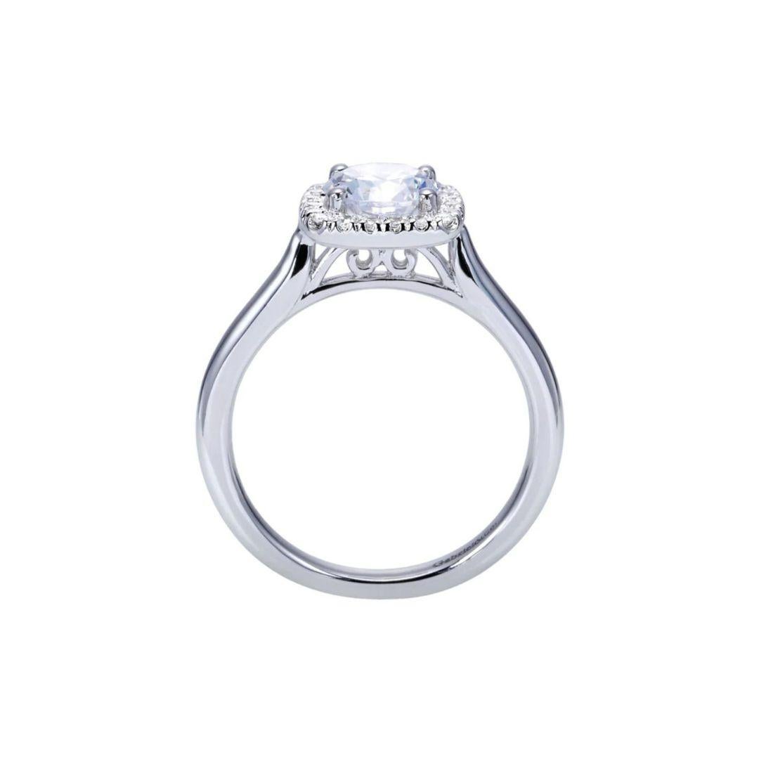 Ladies' Cushion Halo 14k White Gold Diamond Engagement Mounting. Clean lines on the shank of the ring lead up to a cushion shaped pave diamond halo (it takes a round stone 1.5 - 2.0 carat weight) Classic halo version of Tiffany style engagement