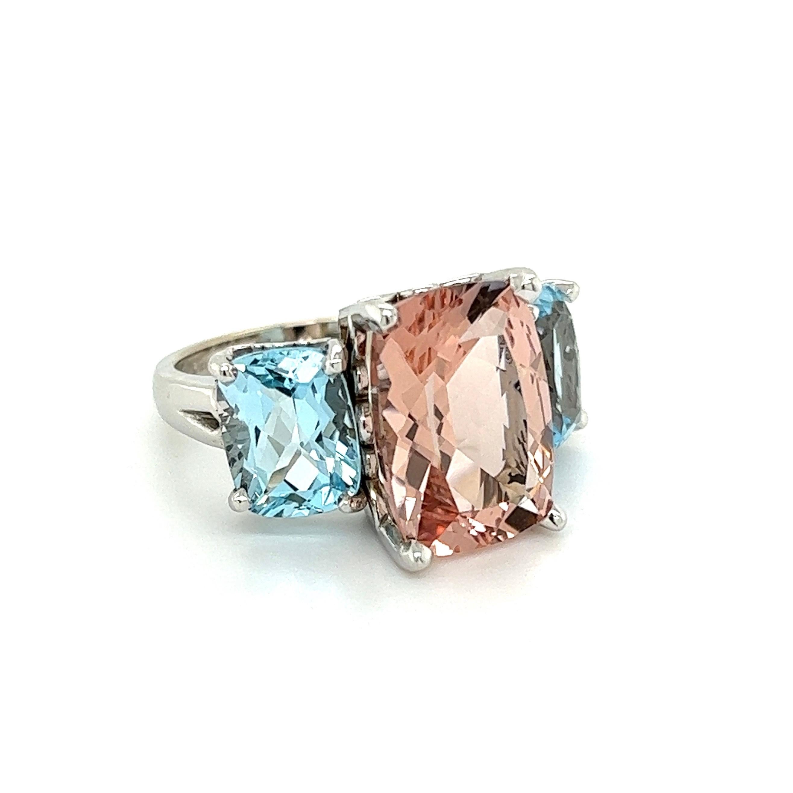 Simply Beautiful! Three Stone Cushion-cut Morganite and 4tcw Cushion Aquamarine Band Ring. Securely Hand set Gemstones measuring approx. 14mm x 10mm Morganite and 9mm x 7mm Aquamarines. Beautifully Hand crafted in 14K White Gold mounting. Dimensions