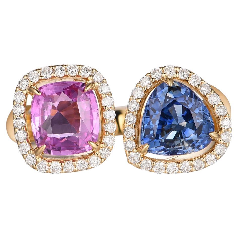 Presenting our stunning Cushion Pink and Blue Sapphire and Diamond Toi Et Moi Ring in 18K Yellow Gold. This exquisite piece of jewelry is a true embodiment of elegance and charm. The ring features a captivating combination of a 1.34 carat