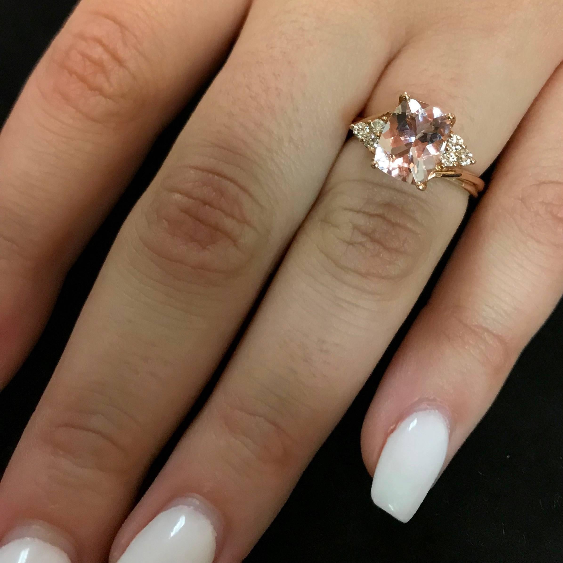 Material: 14k Rose Gold 
Center Stone Details: 1.9 Carat Cushion Cut Morganite 6.7 x 8.7 mm
Mounting Diamond Details: 6 Round White Diamonds Approximately 0.15 Carats - Clarity: SI1-SI2 / Color: H-I
Ring Size: Size 6.5. Alberto offers complimentary