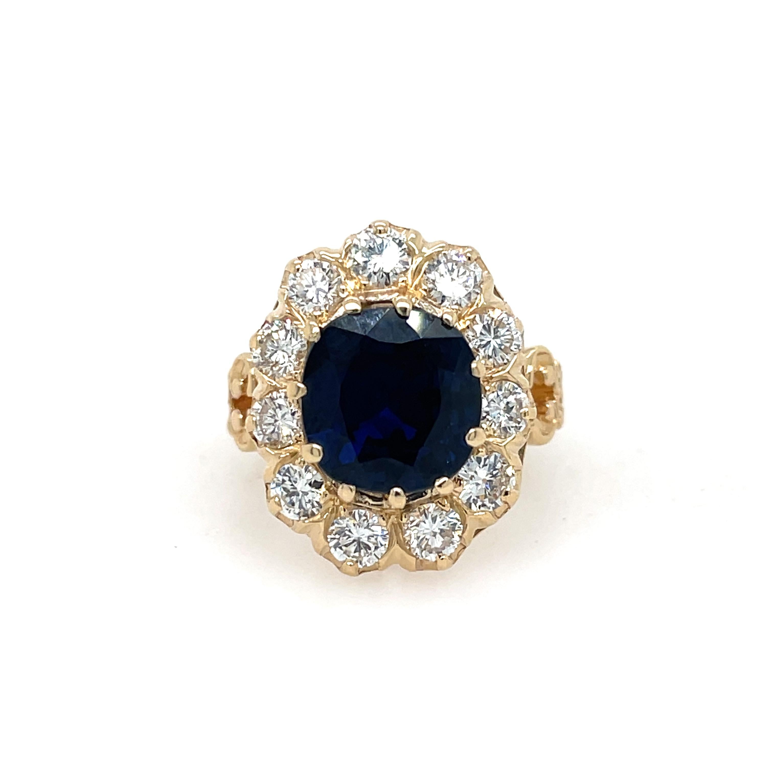 Cushion Sapphire and Diamond Ring in 18K Yellow Gold. This ring features a Cushion Cut 3.96ct Blue Sapphire (GIA Certified) as the center stone, accented by a halo of 11 round cut diamonds. Size 6.25
9.2 Grams
