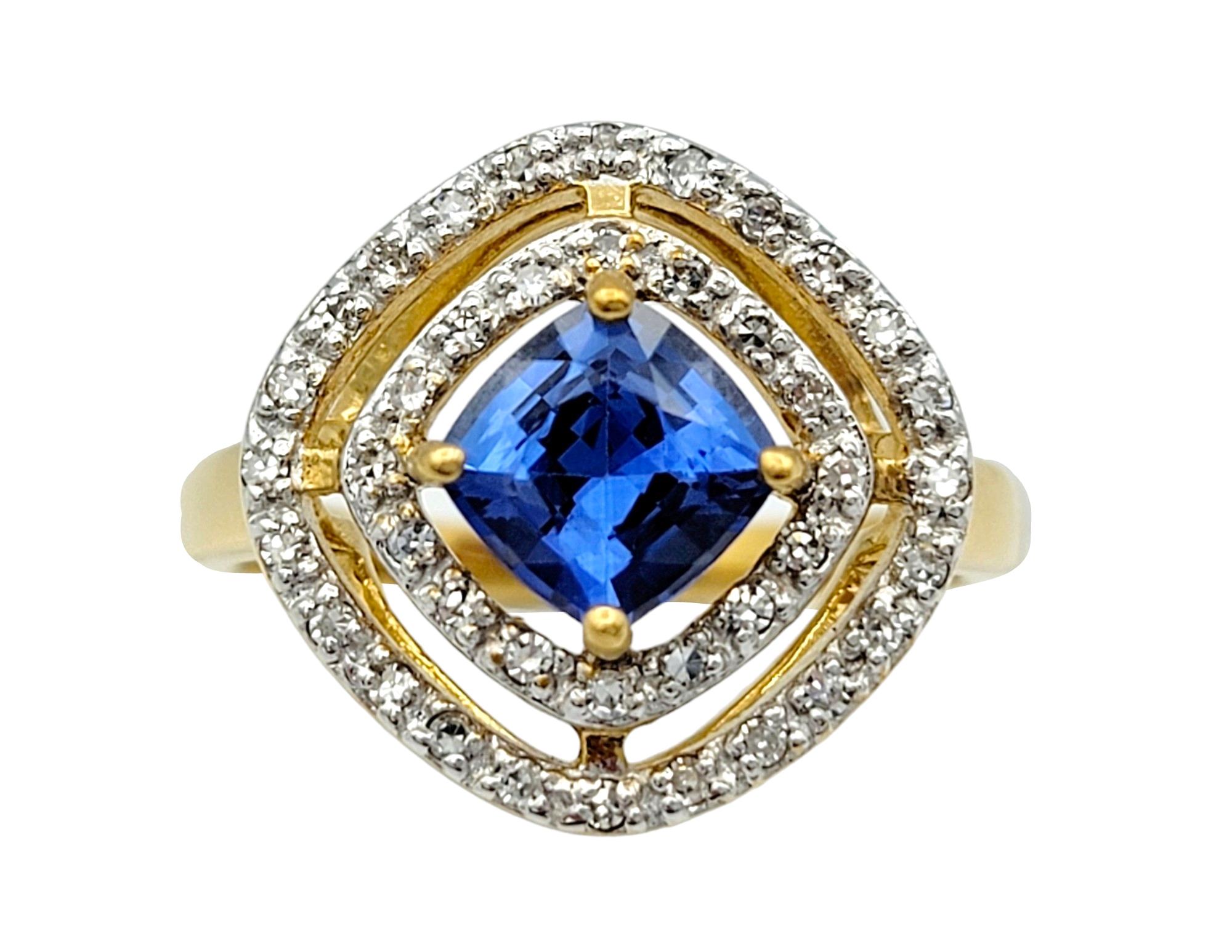 Ring Size: 7

This timeless sapphire and diamond ring is a captivating piece of jewelry set in lustrous 18 karat yellow gold. At its heart lies a magnificent cushion-cut sapphire, its deep and alluring hue drawing the eye with its enchanting beauty.