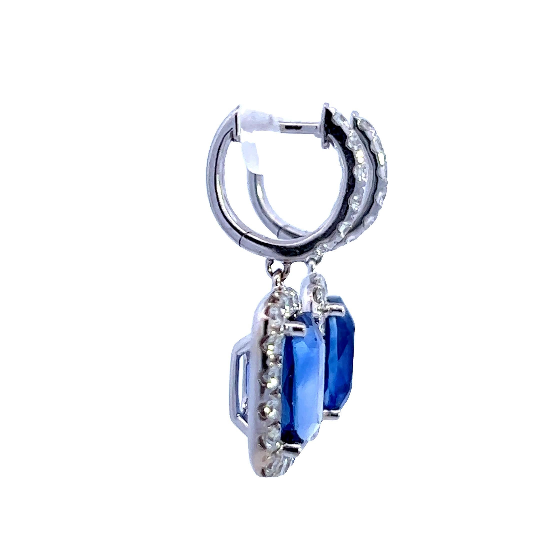 Elevate your elegance and make a bold statement with our stunning pair of Sapphire and Diamond Earringst.  8.61ct Cushion Sapphire. 1.38ct Round Diamond. 18k white gold.  Wholesale at $30,000