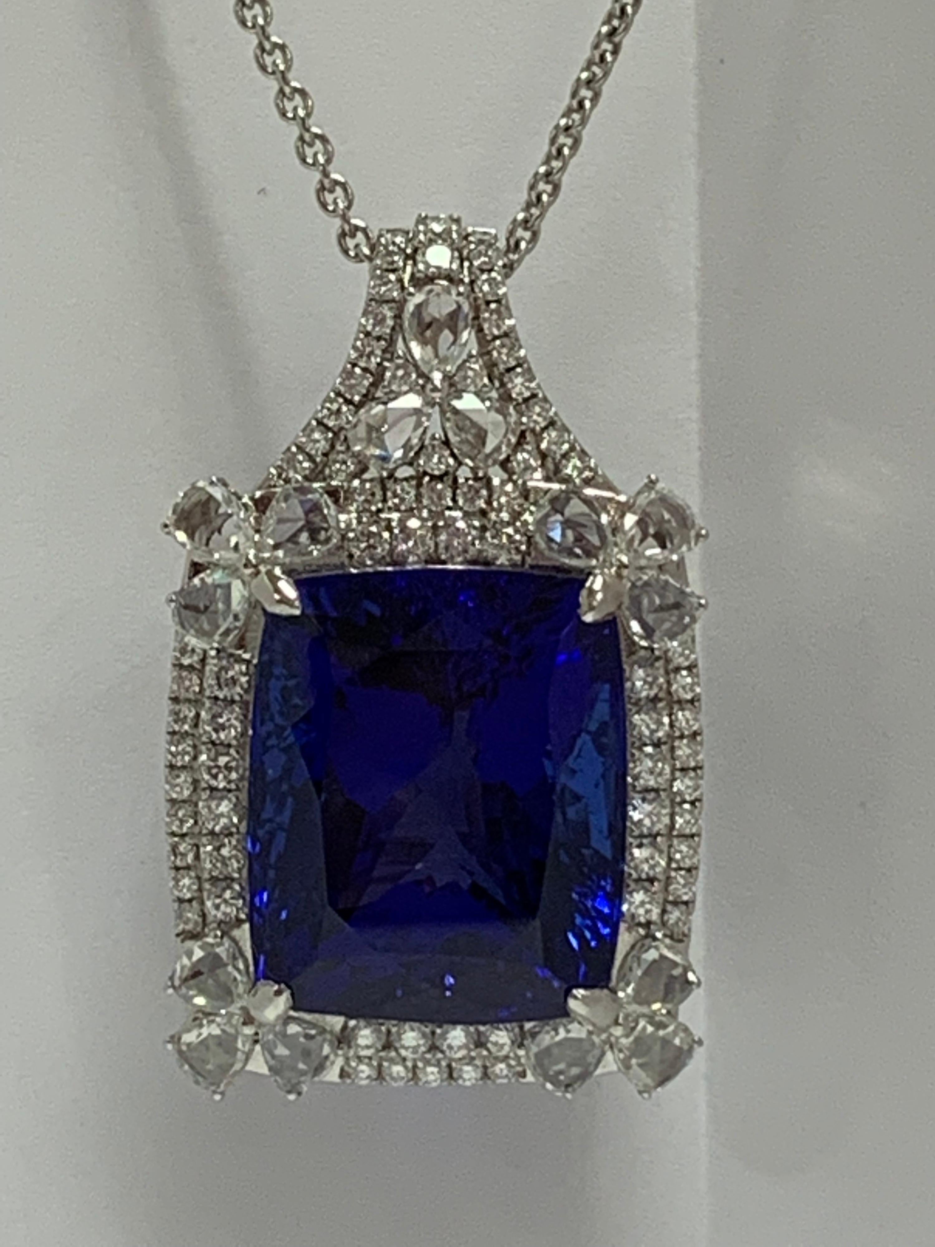 Natural Cushion shape Tanzanite and 2.99 Carat of white Diamonds set in 18 Karat white gold is one of a kind handcrafted pendant. The Pendant include 18 Karat 18 Inches white gold chain .