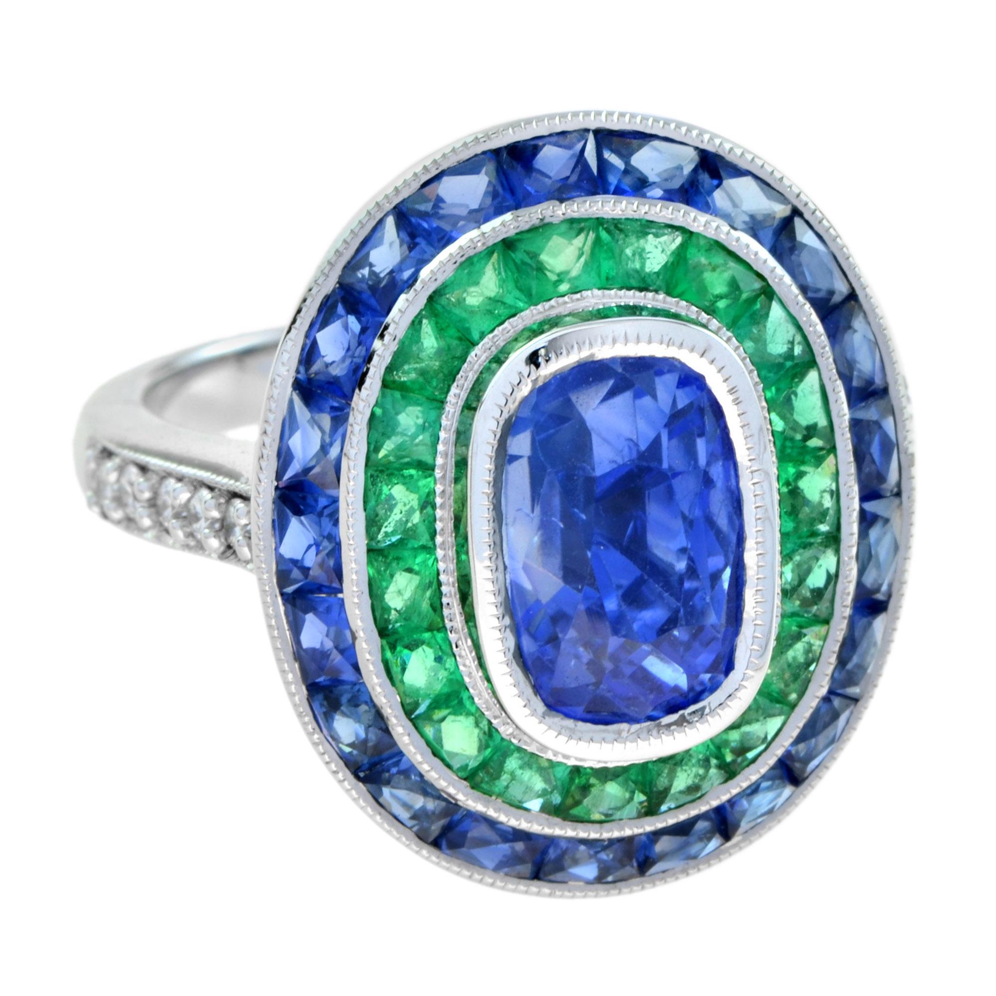 This gorgeous Ceylon sapphire cocktail ring and features and 5.62 carat center stone. It is a very rich and vibrant Ceylon sapphire with a beautiful cushion cut. The ring is accented with French cut emerald and sapphire. The shoulders of the ring